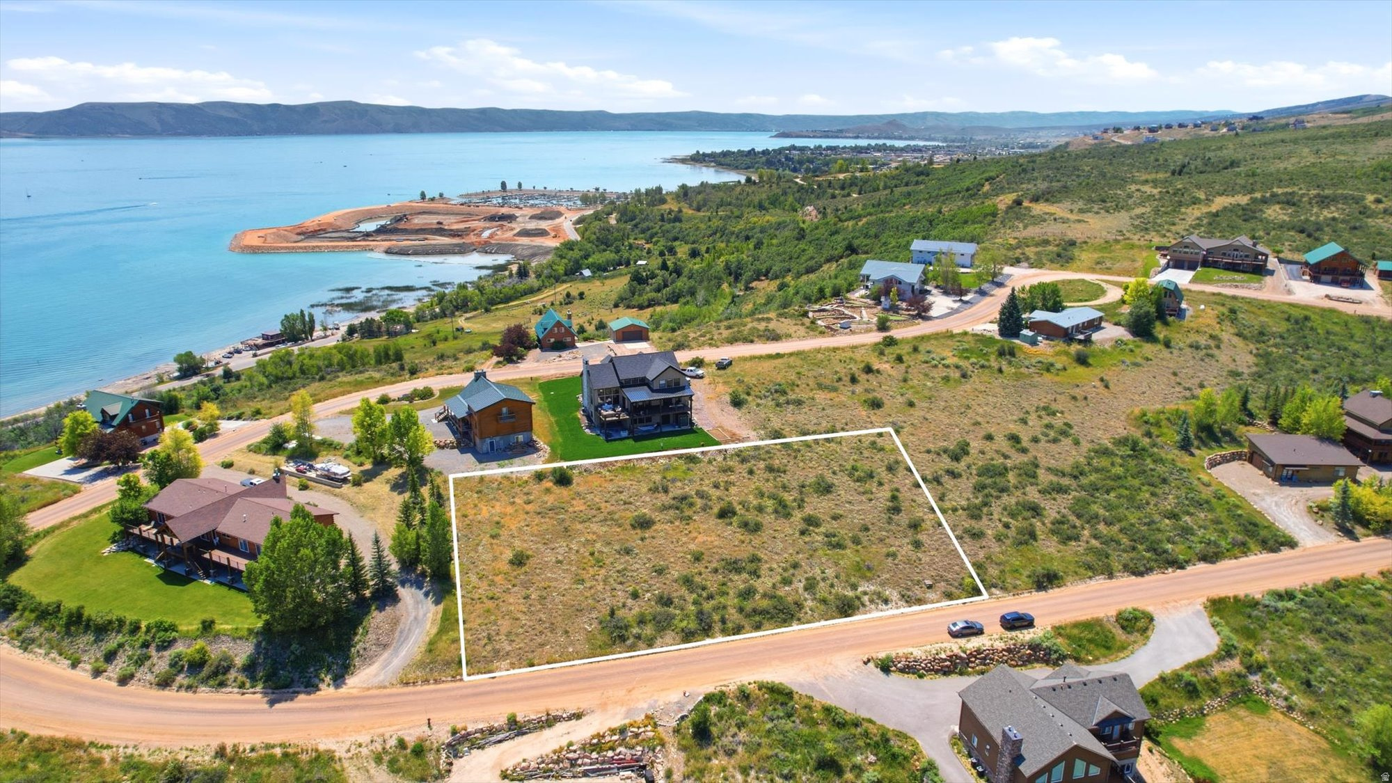 Beautiful views in a private gated community. The gentle slope makes for an easier build.  Lots 44 and 45 were combined to create one large lot to fit the custom cabin designed specifically for this space. The plans can be purchased for an additional cost. Another option is that the lots can be separated back to the original 0.31 acre parcels. No short term rentals are allowed in Swan Creek. More information about the subdivision and HOA can be found at swancreekvillage.org.