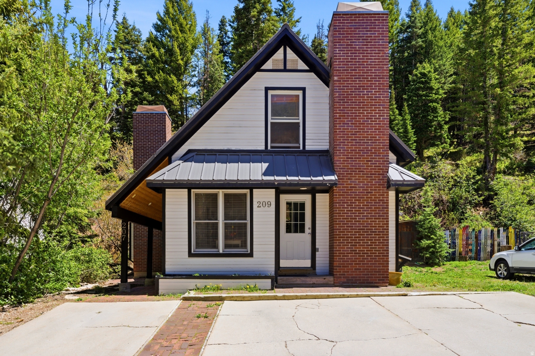 Charming Old Town duplex in an exceptional in-town location on just over 2.3 Old Town lots. Ideally situated just steps from Historic Main Street, 207 & 209 Daly Ave offer 6 bedrooms, 4 bathrooms, and 2,233 square feet configured as two separate 3 bedroom, 2 bath residences.  209 Daly Ave has been thoughtfully updated with granite kitchen countertops, quartz bathroom surfaces, hardwood flooring on the main level, and a fabulous rooftop deck with access from both an upstairs bedroom and exterior rock stairs. 207 Daly Ave is clean, neat, and well maintained in its original condition.  Backing to open space with easy trail access, the property also offers an easy walk to Main Street restaurants, shopping, nightlife, and the free trolley to Town Lift and Park City Mountain Resort. Four off-street parking spaces provide a rare and highly valuable convenience in Old Town.  A unique opportunity offering flexibility for investment, rental income, or mountain living in one of Park City's most sought-after neighborhoods.