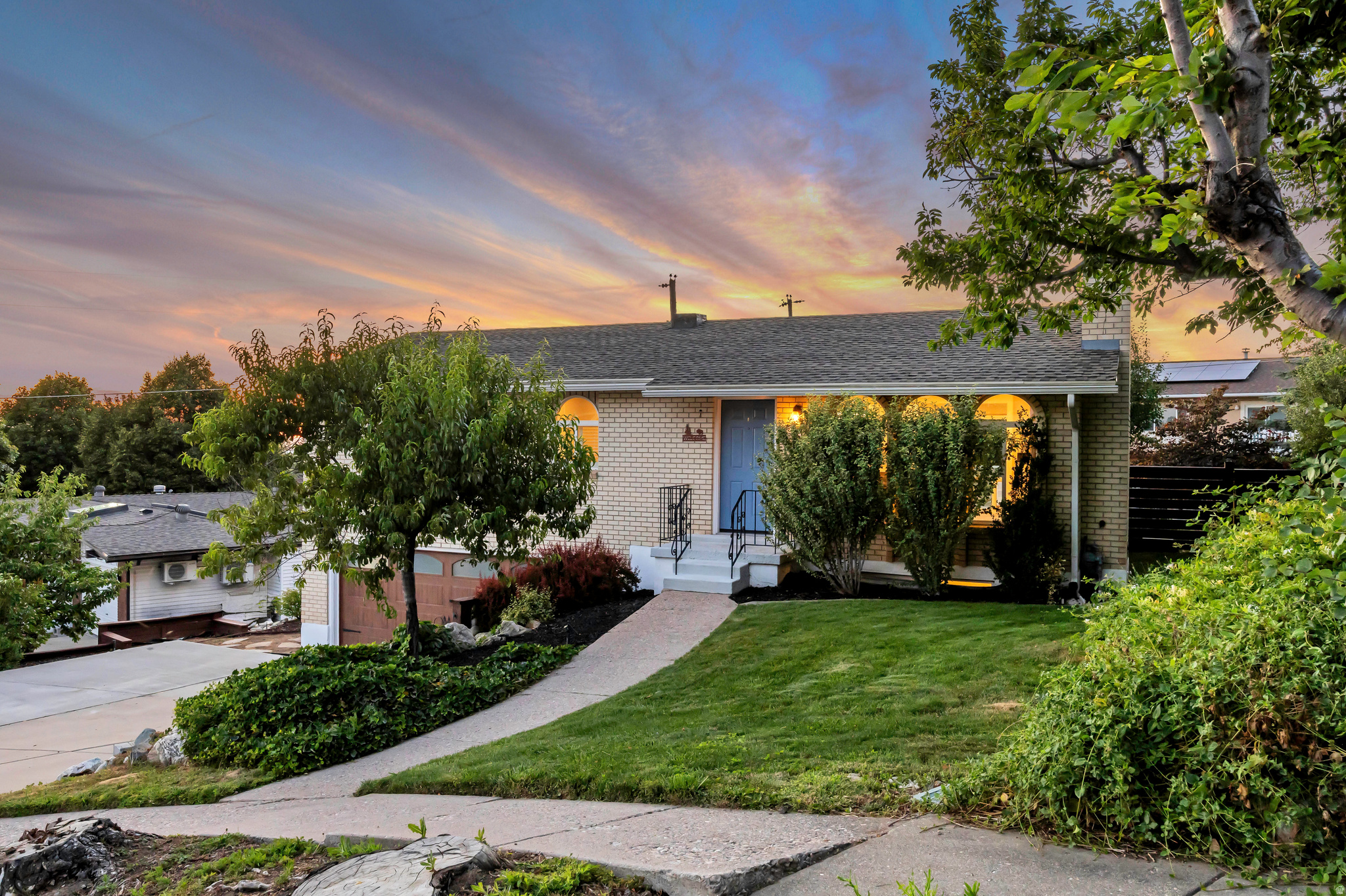 COME AND SEE THIS! Welcome home to this beautifully remodeled Farmington gem, perfectly situated on a quiet cul-de-sac with amazing sunset and city views. Conveniently located just minutes from the freeway, Station Park, Lagoon, shopping, dining, and everyday amenities, this home offers comfort, style, and location.  Step inside to an open, modern floor plan that has been thoughtfully redesigned from top to bottom. The stunning kitchen features quartz countertops, brand-new appliances, updated cabinetry, making it the heart of the home. Throughout the home, you'll find new paint, new flooring, new carpet, new tile, new vinyl plank flooring in the basement, updated lighting, new ceiling fans, custom built-in shelving, new closets, and beautiful new baseboards and window trim.  The bathrooms have been completely renovated with new countertops, updated plumbing fixtures, a modern smart mirror, and new toilets. Major system updates include a new HVAC system with a heat exchanger, partial electrical upgrades with a new breaker panel, newer windows, and a new sprinkler system for added peace of mind. tankless water heater  Relax upstairs by the gorgeous new electric fireplace with its custom mantel, or enjoy the warmth of the wood-burning fireplace in the basement. Every detail has been carefully updated to create a move-in-ready home with timeless style and modern convenience.  With incredible views, extensive renovations throughout, and an unbeatable Farmington location, this is a home you won't want to miss.