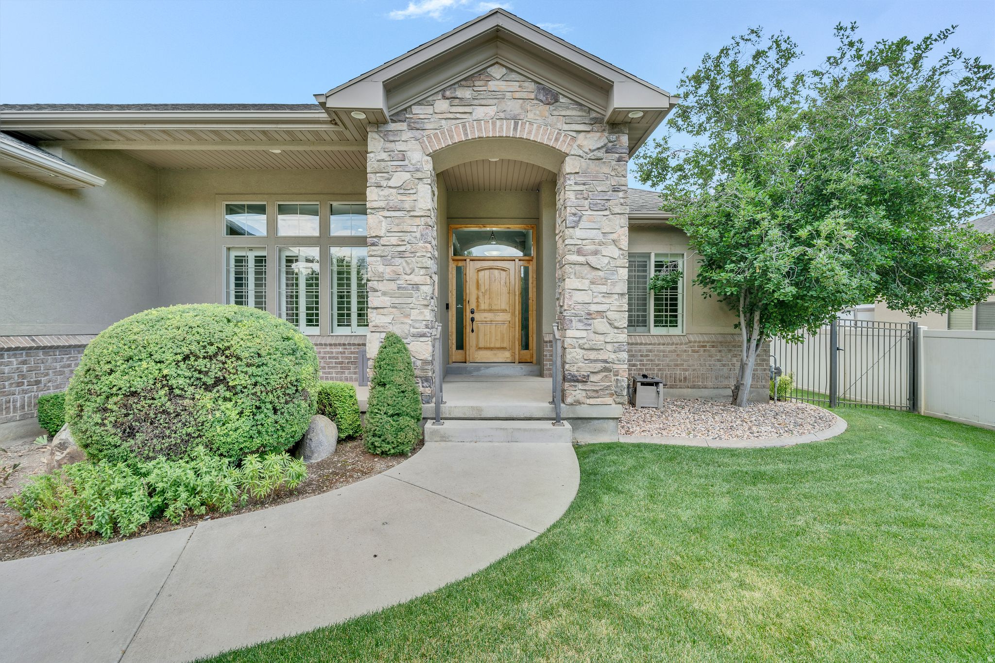 Welcome to one of Spanish Fork's most desirable neighborhoods! This beautifully maintained home offers an incredible layout with soaring ceilings, abundant natural light, and inviting spaces designed for both everyday living and entertaining. The private primary suite is thoughtfully tucked away on its own wing, creating a peaceful retreat. The fully finished basement provides additional living space with endless possibilities, while the beautifully landscaped yard and backyard patio are perfect for relaxing or gathering with family and friends. Just steps from the Spanish Fork Sports Park and walking trails, this home offers the perfect combination of comfort, location, and lifestyle.