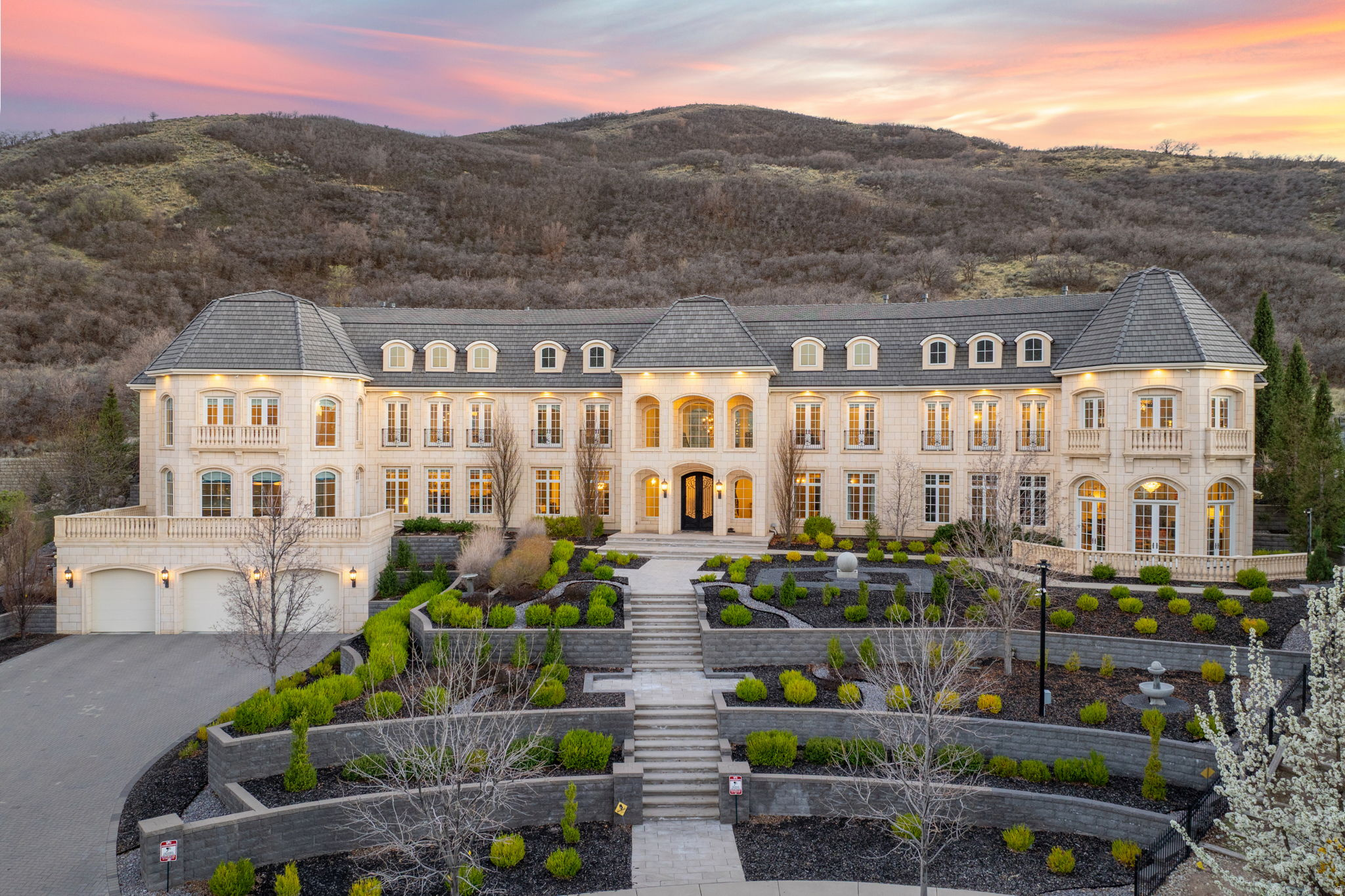 Set high on Draper's east bench, this extraordinary estate is one of Utah's most iconic residences. Inspired by the French countryside, the home captivates with its dramatic arrival, timeless architecture, stunning floor plan, and exquisite detail throughout. Rich with high-end finishes often reserved for homes in an even higher price tier. This residence masterfully blends elegance with comfort. Grand yet inviting, it features expansive family spaces, formal living areas, 9 fireplaces, music rooms, ballrooms, playrooms , and spacious gourmet kitchens. Designed for both luxurious living and unforgettable entertaining, this is a home that leaves a lasting impression at every turn. The photos speak for themselves-and will have you saying wow over and over again.