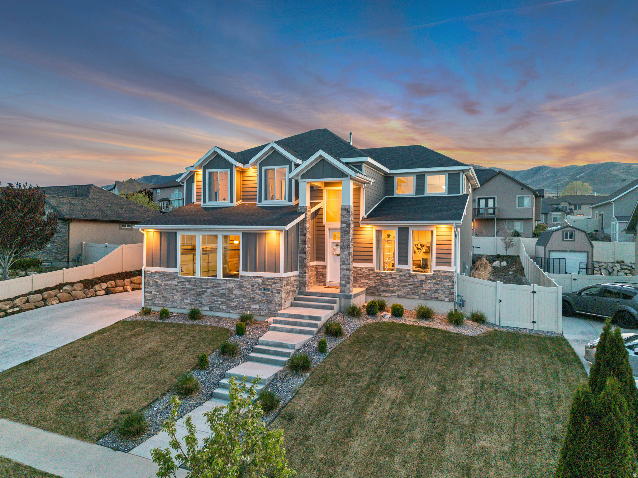 OPEN HOUSE - Saturday May 9, 2026, 11am-2pm  Gorgeous custom home located in the highly sought-after Summerhill subdivision of Saratoga Springs! This vibrant sidewalk community offers convenient access to Utah Lake, parks, and outdoor recreation.This spacious 6-bedroom, 3.5-bath residence delivers the perfect blend of style, comfort, and functionality. The main level showcases durable laminate flooring, soaring vaulted ceilings, and a stunning fireplace that anchors the bright, open living space. The kitchen is beautifully appointed with custom white cabinetry, granite countertops, and detailed tile work throughout.Retreat to the oversized primary suite featuring a large walk-in closet and private en suite bathroom. Generously sized bedrooms provide flexibility for family or guests. The recently finished basement is a true standout-thoughtfully designed with quality finishes, offering additional living space ideal for entertaining, relaxing, or multi-generational living. Enjoy outdoor living year-round on the covered Trex-style deck, perfect for taking in the surroundings. The property also features a 3-car extra-deep garage and RV parking, providing ample space for vehicles, toys, and storage. With exceptional pride of ownership evident throughout, this move-in-ready home offers outstanding value in one of Saratoga Springs' most desirable neighborhoods.  Square footage figures are provided as a courtesy estimate only and the buyer is advised to obtain an independent measurement.