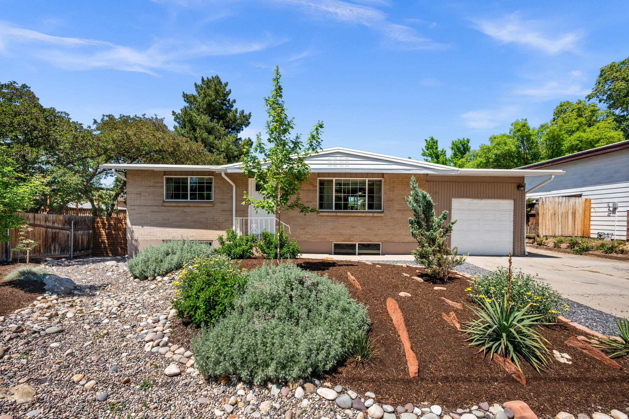 Mountain views greet you right out the front door of this beautiful Sandy home, and the curb appeal delivers from the start with a stunning xeriscaped front yard that is as low-maintenance as it is eye-catching. Inside, the open, spacious layout is filled with bright natural light, making every room feel warm and inviting. Four bedrooms and two full baths give you all the space you need, while the backyard is a true retreat with beautiful landscaping and mature trees that create a peaceful, private setting. And when adventure calls, you are perfectly positioned for it. Big Cottonwood and Little Cottonwood Canyons are right up the road, putting world-class skiing, hiking, and everything the outdoors has to offer just minutes from your front door. Don't forget the 1-car garage for all of your gear (or car). This is the kind of home that checks every box and feels like home the moment you walk in. *Square footage figures are provided as a courtesy estimate only and were obtained from the county assessor. Buyer is advised to obtain an independent measurement. All information herein is deemed reliable but not guaranteed.*