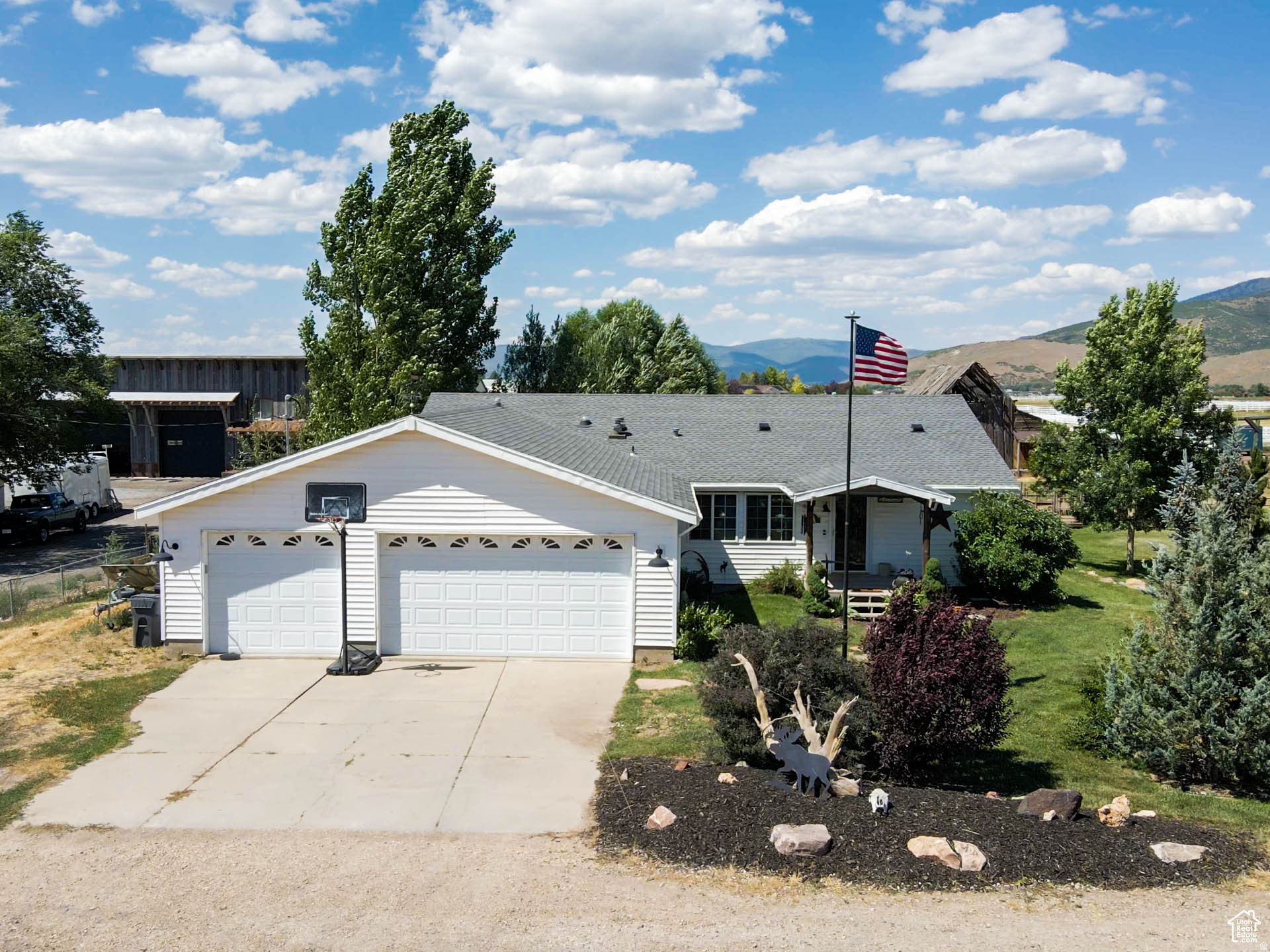 *OPEN HOUSE 7/11 11:00am-2:00pm* **PRICED WELL AT LESS THAN WHAT IT APPRAISED FOR!!** Escape to the country with this stunning 3-bedroom, 2-bathroom home nestled on a picturesque 1-acre lot.  Enjoy the soothing sounds of a year-round spring flowing through the property, perfect for tranquil evenings or morning coffee by the water. The heart of the home features a cozy wood-burning fireplace that can heat the entire house. Car enthusiasts and hobbyists will love the spacious heated three-car garage, offering ample room for vehicles, storage or a workshop. Outside, the acre of land offers endless possibilities-whether it's having horses, creating a vibrant garden, setting up a fire pit for starry nights or barbequing on the deck with friends. The property is enveloped by mature trees, providing privacy and a sense of seclusion, yet it remains conveniently accessible to nearby towns for everyday needs. Fun activities like boating, fishing, bike riding, skiing and shopping at Jordanelle Reservoir and Park City are only approximately 25 minutes away! This home is also just minutes away from the Uintah Mountain entrance. The roof is only three years old and a new water heater was just added this winter. Property is zoned as residential/commercial for unlimited potential!