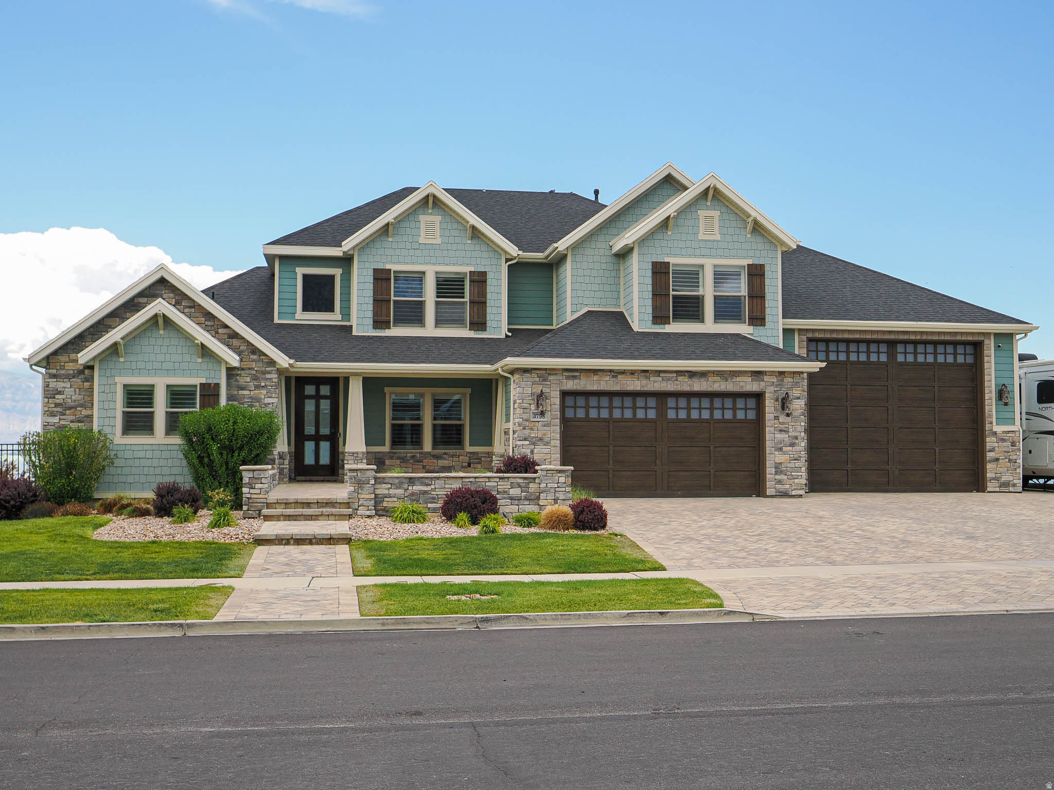 ***OPEN HOUSE SATURDAY 7/11/26 12:00 PM TO 2:00 PM*** Experience lakefront living at its finest in this custom 6-bedroom, 4-bath home, where luxury finishes, breathtaking views, and exceptional craftsmanship come together in one unforgettable property. Beautiful wood floors, vaulted ceilings, and thoughtful updates create an inviting atmosphere throughout. Just off the entry, a bright den with shiplap detailing offers the perfect home office or sitting room. The great room showcases a stunning wall of windows framing panoramic lake views, a floor-to-ceiling stone gas fireplace, and direct access to the expansive deck. The gourmet kitchen is designed for both everyday living and entertaining, featuring granite countertops, a gas Wolf range, double ovens, a large island, pantry, and separate dining area, with additional access to the recently expanded deck overlooking the water. The main-level primary suite is a private retreat complete with plantation shutters, a spacious walk-in closet, spa-inspired en-suite bathroom, and private deck access. A large laundry room with built-in cabinetry, mudroom, and powder bathroom complete the main level. Upstairs, a versatile loft overlooks the great room, while three spacious bedrooms with extra-high ceilings provide a bright and open atmosphere. A full bathroom with a double vanity serves the upper level. The walk-out daylight basement features soaring 12-foot ceilings, a spacious family room with a stone gas fireplace, kitchenette, den, two large bedrooms connected by a Jack-and-Jill bathroom, an additional powder bath, second laundry area, abundant storage room, and direct access to the lower deck with a gas firepit. Outside, the resort-style backyard is truly one of a kind, featuring tiered decks leading to a custom pool with multiple water features, a waterslide, hot tub, pergola, and breathtaking panoramic lake and mountain views. Additional highlights include an extra-deep 6-car garage with epoxy floors and an RV-height door, two water softeners, and recently updated carpeting, interior, and exterior paint. Ideally located just minutes from parks, scenic trails, Pelican Bay, and the Saratoga Springs City Marina, this extraordinary lakefront home offers an unmatched combination of luxury, recreation, and breathtaking waterfront living. AGENTS - READ AGENT REMARKS