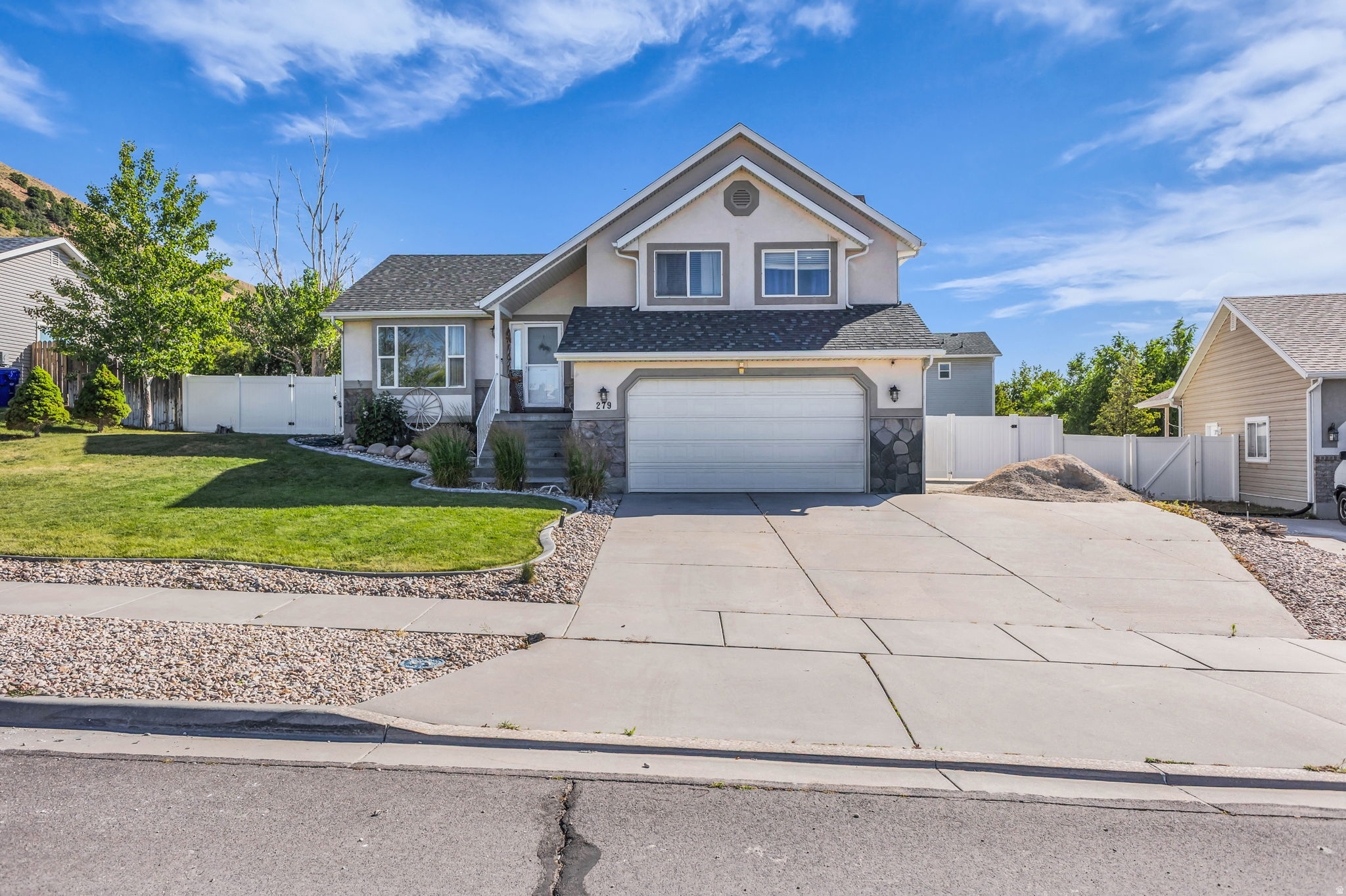 Tucked away on the quiet south end of Tooele, this 4 bed, 3 bath home offers a setting that's hard to beat - from the backyard, the mountains of Settlement Canyon feel close enough to touch. It's the kind of peaceful spot where evenings are best spent around the firepit, taking in the views as the sun dips behind the ridgeline. The curb appeal speaks for itself, with a beautifully maintained front yard anchored by a graceful willow tree. Inside, you'll find new LVP flooring throughout (installed just 4 years ago) for a fresh, modern feel with easy upkeep. The oversized garage gives you room for vehicles, toys, and storage - and Settlement Canyon's hiking, fishing, and recreation are just a few blocks away. Best of all? This location offers incredible value - more home for your money in one of Tooele's most peaceful neighborhoods. Priced great and ready for its next owner. Schedule your showing today!