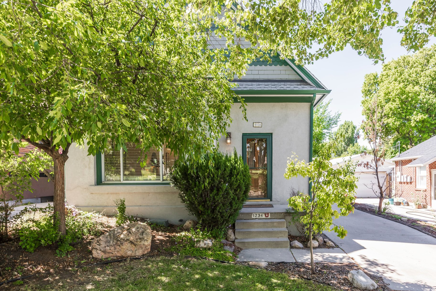 Welcome to 1234 E Emerson, where vaulted ceilings, abundant natural light, and thoughtfully designed living spaces create a warm and inviting atmosphere. Skylights throughout the home enhance the bright, open feel, filling the interior with natural sunshine year-round. This two-bedroom, two-bathroom home features an open-concept layout providing comfortable living and entertaining spaces while maintaining a sense of privacy and functionality. Step outside to enjoy the newly constructed deck, an ideal setting for outdoor dining, morning coffee, or relaxing evenings overlooking the private, fenced yard. The outdoor space offers a peaceful retreat with room for gardening, pets, or play. Conveniently located near the University of Utah, major medical and research campuses, and the scenic McClelland Trail. Whether you seek outdoor adventure, an easy commute, or a welcoming place to call home, this property delivers the perfect balance of comfort, convenience, and lifestyle.