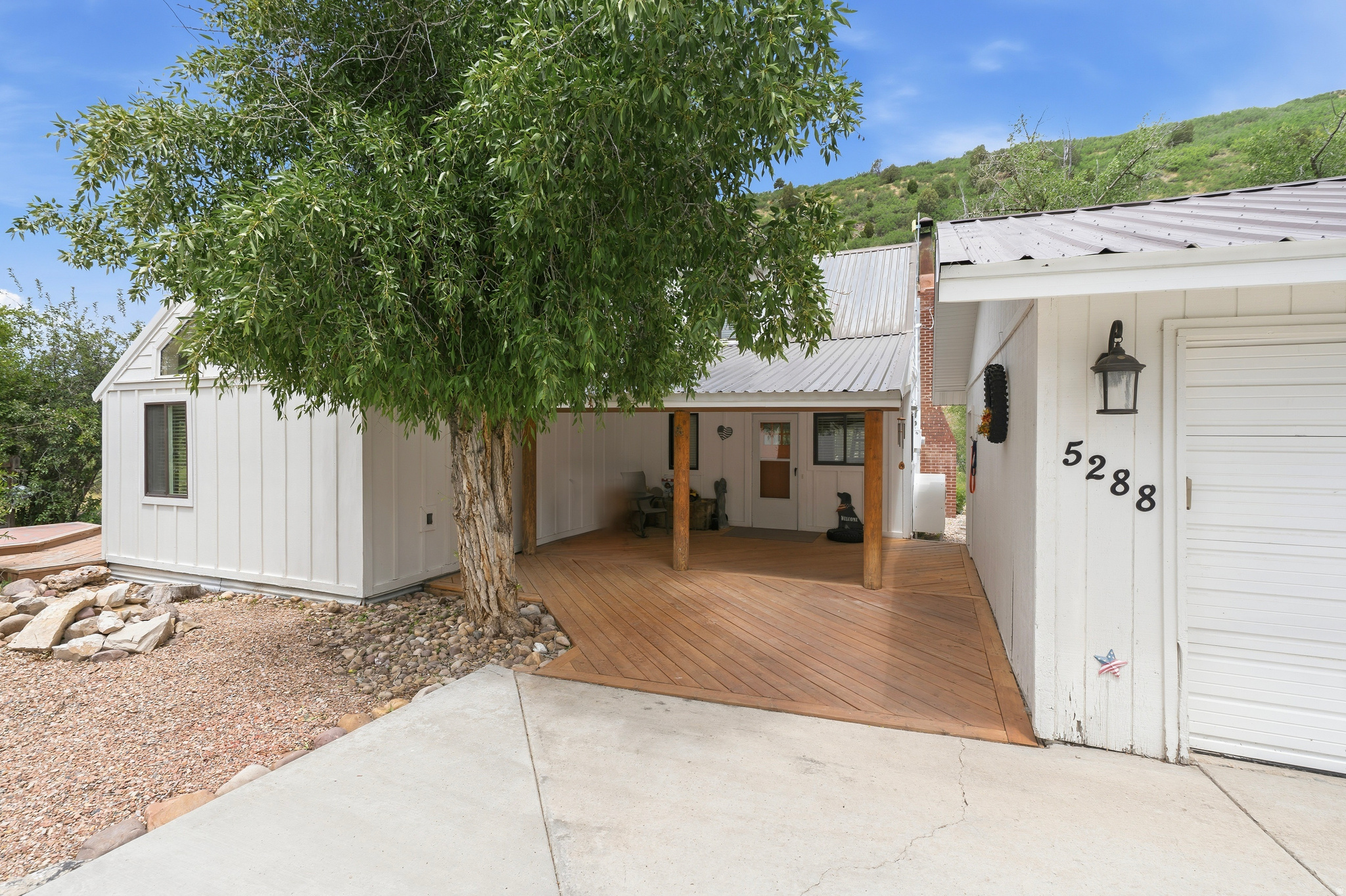 Experience the best of mountain living in this beautifully remodeled 3 bdr, 3 bath home. This home combines modern comfort with it's scenic surroundings, creating the perfect year-round residence or mountain getaway.  There is plenty of parking for your toys in the 4 car garage and additional outdoor parking for an RV. Adjacent lot is .13 acre (KK-4-B) and has a motorcycle/pump track that is included in sale of home creating a half acre in total.   Square footage figures are provided as a courtesy estimate only and were obtained from county records.  Buyer is advised to obtain an independent measurement.