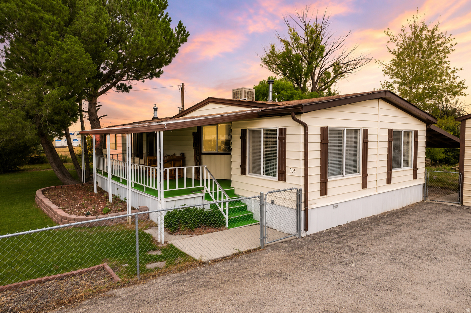 Country roads lead you home! If you've been dreaming of a little extra space, peaceful surroundings, and a place that feels like home the moment you pull in, this Elmo gem is calling your name! Situated on 0.40 acres, this adorable 3-bedroom, 2-bath home is packed with charm and the kind of country lifestyle that's hard to find. Inside you'll love the updated kitchen, spacious living areas, two cozy fireplaces, and a large walk-in closet. The home has been thoughtfully updated while still keeping its warm, welcoming feel. Step outside and imagine slow mornings on the huge covered front porch with a cup of coffee, evenings under the shade of the beautiful mature trees, and plenty of room for kids, pets, gardens, and gatherings in the fully fenced yard. Two secondary water hookups and sprinkler system to keep everything green is a breeze. Need a shop? This property delivers! The 22' x 28' metal shop with a 10-foot overhead door is perfect for projects, parking your toys, storing equipment, or creating the ultimate workshop. Located in the quiet farming community of Elmo, you'll enjoy the slower pace of country living while still being just a short drive from town. It's the perfect place to spread out, breathe deep, and enjoy the simple things in life.  Homes with this much charm, space, and country character don't come along often. Come see why you'll want to call this one home!