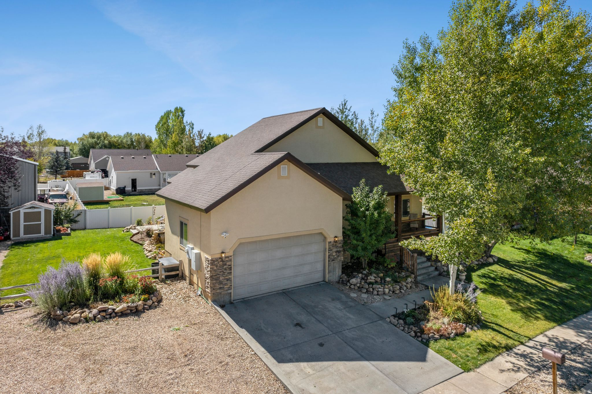 This inviting ranch-style home with a full lower level offers the ease of main-level living combined with generous space for gathering, relaxing, and entertaining. From the moment you step inside, vaulted ceilings and an open, welcoming layout create an immediate sense of comfort and connection throughout the home. Warm bamboo flooring flows through the main living areas, linking the bright great room to a semi-formal dining space and a thoughtfully designed kitchen. The kitchen features stainless steel appliances, granite countertops, and a gas range, making it well suited for both everyday cooking and hosting family gatherings. A spacious eat-in area comfortably seats eight and opens to the outdoors through a new 8-foot sliding glass door, creating a seamless indoor-outdoor connection beside the cozy gas fireplace. A convenient powder room serves guests on this level. The primary suite offers a peaceful retreat with vaulted ceilings, private outdoor access, and a generous en-suite bathroom complete with a soaking tub, separate shower, dual vanities with granite countertops, a water closet, and a walk-in closet. Two additional bedrooms and a full bathroom on the main level provide comfortable space for family or guests. On the lower level, the expansive family room becomes the hub for casual living, offering plenty of room for movie nights, games, and gatherings. An adjoining bar area includes a wet bar, refrigerator, and seating space, and can be closed off with a barn door when desired. This level also features a flexible space ideal for a home gym, office, or hobby room. Newly installed LVP flooring throughout the lower level adds durability and easy maintenance. Three additional bedrooms and a full bathroom complete the lower level, giving everyone plenty of room to spread out while maintaining a warm and functional flow throughout the home. All information in this listing, including sq ft, is provided as a courtesy and is not guaranteed. Buyer is responsible for verifying information to his or her satisfaction, obtaining measurements and/or appraisals as necessary.