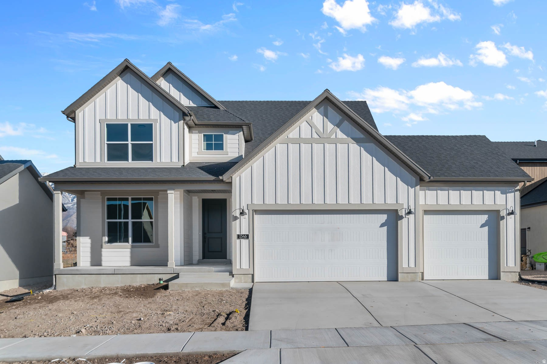 Brand new 2050 Farmhouse home in a great Provo with beautiful lake views! Features include crisp white laminate cabinets, quartz countertops, and stainless steel gas appliances - a kitchen designed for both elegance and everyday use. The home's flooring blends laminate hardwood, tile, and carpet, combining durability with comfort throughout. A roomy 3-car garage with keypad and exit door adds convenience and ample storage. Natural light floods through a box window in the kitchen nook, while can lighting and Christmas light outlets add charm and practicality. The home also includes a tankless water heater and energy efficient features to keep utility costs down. Interior details like metal railing at the stairway, Craftsman base and casing, and black matte hardware bring modern refinement. The owner's bathroom is a true retreat with cultured marble shower surrounds, emphasizing both comfort and style. Come check it out today! Whether for family living or entertaining, this 2050 Farmhouse delivers a perfect balance of timeless design, smart upgrades, and everyday functionality.