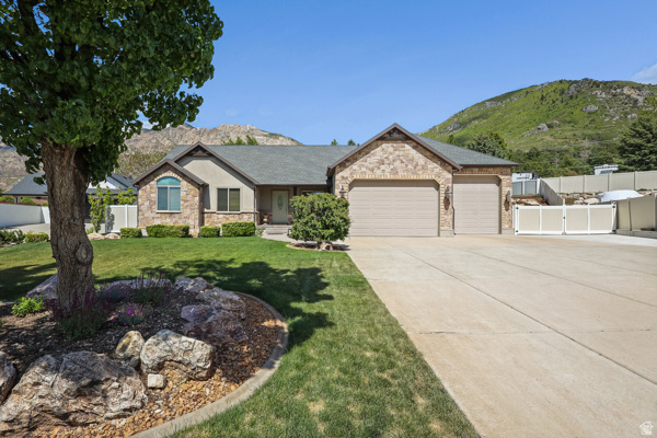 Nestled in a Quiet Cul-de-Sac, this Beautiful Rambler sits on a .46 Acre Lot with Privacy & Gorgeous Mountain Views!! * Beautiful Yard with 20' x 40' Pool, Putting Green, Large Patio, and full Vinyl Fence * Very Open Floor Plan with Vaulted Ceilings and a Stone Fireplace * Huge Dining/2nd Family Room on the Main Floor surrounded with windows for open views of the Pool and Mountains * Great for Entertaining! * Spacious Dream Kitchen with Custom Cabinets, Granite Countertops, a large Island with 5 Built-in Chairs, and a Separate Pantry * Updated Stainless Appliances with Double Ovens,  Gas Range, Microwave, & Included Refrigerator * Large Primary Suite with Vaults, Hardwood Floors, and a Large Window with Views * Walk In Closet & Spacious Primary Bathroom with Double Sinks with a Garden Tub & Custom Tiled Shower * Office (or Bedroom) with French Doors & Custom Built-in Desks, Cabinets, Shelves, & Closet * Updated Hardwood Floors * Mother in Law Apartment with a Kitchenette, Dining Area, Family Room, plus 3 Large Bedrooms and a Full Bathroom * Custom Painted Venetian Plaster Walls * Oversized Heated 4 Car Garage with Workbench, Sink, 12 Foot Garage Door, & Extra Storage * Huge RV Pad for at least 2 RV's, Trailers & Toys with 220-amp Power * New Top of the Line Lennox HVAC with 20 Year Warranty * Two Water Heaters & Water Softener * Extensive Vivint Security System with Alarms on Every Window & Exterior Door * Washer & Dryer Included * Located Right by the Mountain - You'll Love the Access to the many Hiking Trails in the Area, Ski Resorts, & Water Activities at Pineview Reservoir * Oaklawn Park is just 1 Block Away! - Baseball, Trails, Trees, & Picnic Areas * Come schedule a tour today!