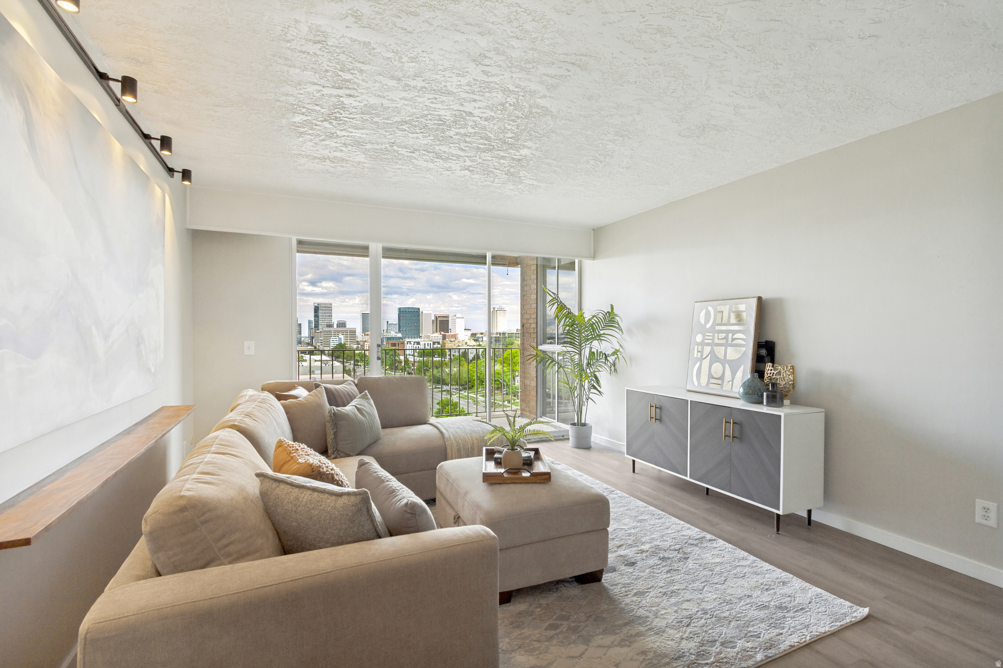 Price reduced! Amazing deal! Enjoy downtown Salt Lake living at its finest! This two bedroom condo in the Stansbury building is full of natural light and updated beautifully. The west facing windows and covered balcony give breathtaking views of the downtown skyline, capitol building and nightly sunset shows. This condo is fully updated with every modern touch including Google Fiber, dishwasher, disposal (1 year old), fridge (1 year old), microwave, granite counters, and laminate flooring throughout. Enjoy plenty of in unit storage with multiple closets as well as an assigned storage unit in the garage. You'll never have to worry about downtown parking with an assigned garage space as well as a parking lot space. Easy access to the University of Utah with a Trax stop two blocks away and a bus stop right outside the front door. Enjoy onsite laundry, BBQ, and picnic areas. This condo is truly a gem in a very well managed and desirable building perfectly situated downtown with restaurants and shopping surrounding you. Units like this don't come up often in this building, so don't miss out on your opportunity to live the downtown Salt Lake lifestyle.