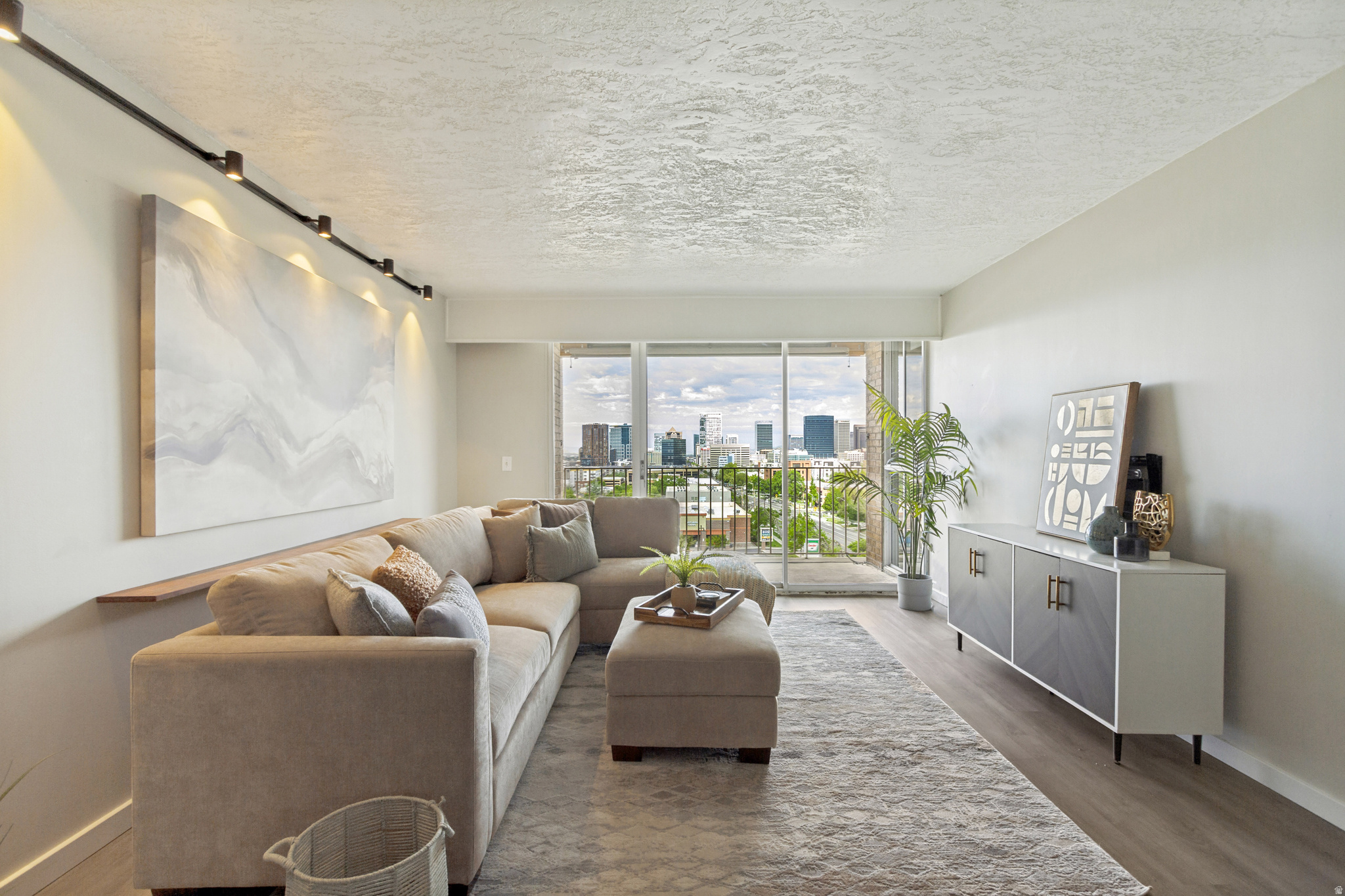 Enjoy downtown Salt Lake living at its finest! This two bedroom condo in the Stansbury building is full of natural light and updated beautifully. The west facing windows and covered balcony give breathtaking views of the downtown skyline, capitol building and nightly sunset shows. This condo is fully updated with every modern touch including Google Fiber, dishwasher, disposal (1 year old), fridge (1 year old), microwave, granite counters, and laminate flooring throughout. Enjoy plenty of in unit storage with multiple closets as well as an assigned storage unit in the garage. You'll never have to worry about downtown parking with an assigned garage space as well as a parking lot space. Easy access to the University of Utah with a Trax stop two blocks away and a bus stop right outside the front door. Enjoy onsite laundry, BBQ, and picnic areas. This condo is truly a gem in a very well managed and desirable building perfectly situated downtown with restaurants and shopping surrounding you. Units like this don't come up often in this building, so don't miss out on your opportunity to live the downtown Salt Lake lifestyle.