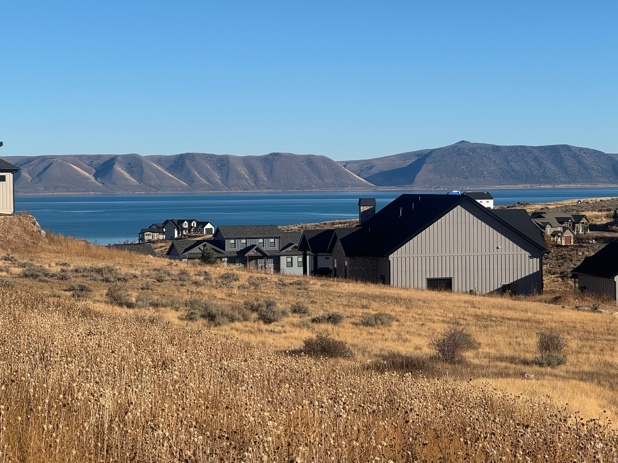 Build your dream home in the exclusive, gated community of The Reserve at Bear Lake. This exceptional lot is fully improved with paved roads and utilities ready to go, including power, water, and sewer stubbed to the property. Ideally located for year-round recreation, you'll enjoy direct access to Fish Haven Canyon for snowmobiling, snowshoeing, hiking, mountain biking, and exploring the extensive ATV/UTV trail system. As an owner in The Reserve, you'll have access to premier amenities, including a beautiful clubhouse with a fitness room, two heated seasonal pools, a year-round hot tub, splash pad, poolside pavilion, basketball, tennis, and pickleball courts, a playground, and gated beach access to the sparkling waters of Bear Lake. This is an incredible opportunity to own a piece of paradise in one of the area's most sought-after communities.