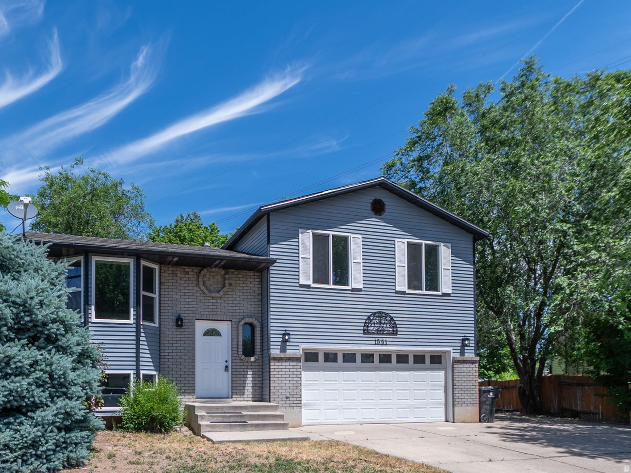 Beautifully remodeled 3-bedroom, 2-bath home featuring a bright, open-concept design and quality updates throughout. Enjoy fresh paint, new luxury vinyl plank flooring, new carpet, updated cabinetry, a new furnace and central A/C system, and a brand-new deck-making this home truly move-in ready.  The oversized 2-car garage includes a 220V EV charging outlet, while the expansive RV parking provides plenty of space for trailers, boats, and recreational vehicles.  Conveniently located near Hill Air Force Base, shopping, dining, entertainment, and highly rated schools, this home offers the perfect combination of comfort, style, and accessibility. Don't miss this opportunity to own a beautifully updated home in a fantastic location.