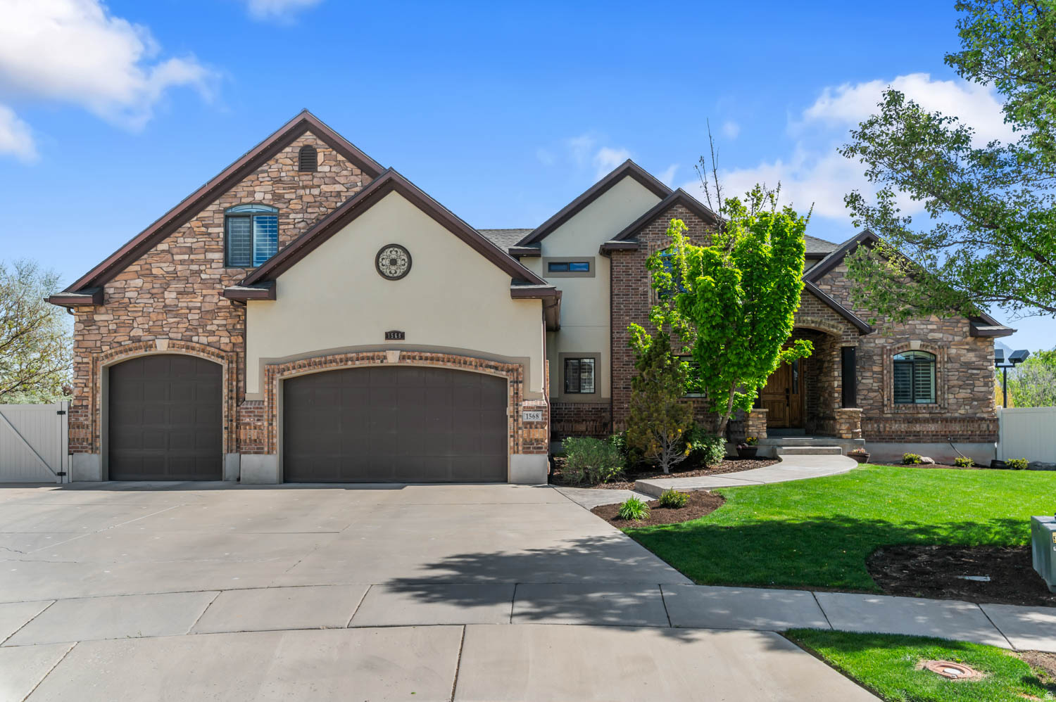 Protected Wasatch Front views on a quiet double cul-de-sac-this 5,146 sq ft home offers space, privacy, and a rare combination of features. Situated on 0.47 acres, the property provides room to live, entertain, and enjoy.  The outdoor space stands out with a private pickleball court, RV parking, and a 4-car garage-offering exceptional flexibility for recreation and storage. The backyard is designed for relaxation, featuring a firepit, hot tub, and sauna. Permanent holiday lighting surrounds the home, while dedicated pickleball court lighting creates a well-lit, inviting space for evening play.  Inside, the home offers a spacious, functional layout filled with natural light and designed for everyday living and gathering.  Well-maintained with key systems addressed over time, this is a rare opportunity to own a feature-rich property with space, views, and lifestyle amenities.