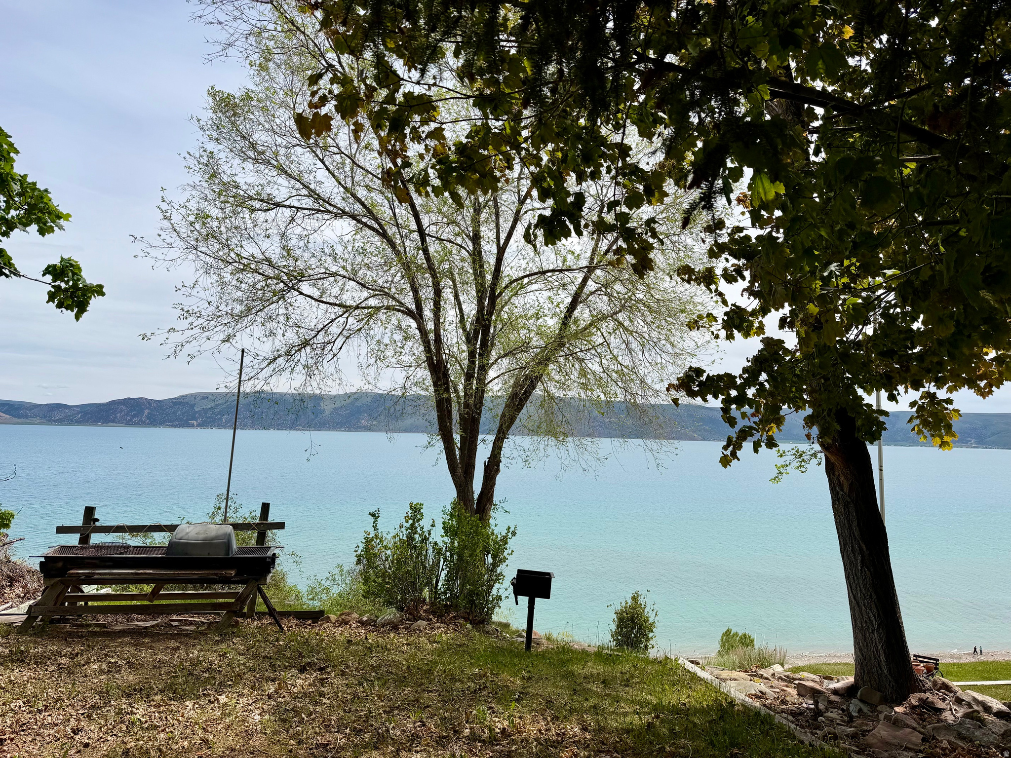 Rare opportunity to own a front row lot in Sweetwater Ridge with breathtaking, unobstructed views of the beautiful blue waters of Bear Lake! Edge lots like this rarely come available, offering panoramic end to end lake views, incredible sunrises, cool summer nights, and the perfect setting for your getaway retreat! Community amenities: swimming pool, basketball court, playground, sand volleyball, picnic areas, and more. Conveniently located near Bear Lake Golf Course, shopping, restaurants, and the bike path for endless recreation and relaxation.