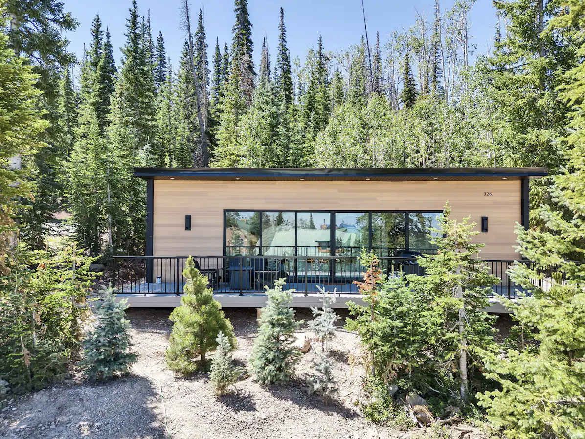 New 2022-built modern cabin next to Brian Head Resort, nestled in the alpine red rock landscape of southern Utah and being sold fully furnished. Open-concept layout with large windows that bring in natural light and wooded mountain views from a serene, mountaintop setting. Both bedrooms function as private ensuites, each with a queen bed and twin trundle. The kitchen is fully equipped with modern appliances, cookware, and ample counter space. In-unit laundry and dishwasher included. Easy access via a paved and plowed road. The house is on all city utilities including water, sewer, electric, and has 1GB fiber internet. Step out to a deck with seating, a gas fireplace, and a gas grill. Free ski shuttle nearby, with skiing, mountain biking, hiking, and miles of trails nearby. Established top performing, high income generating short-term rental with NO HOA, NO CCRs, and STR-approved zoning.