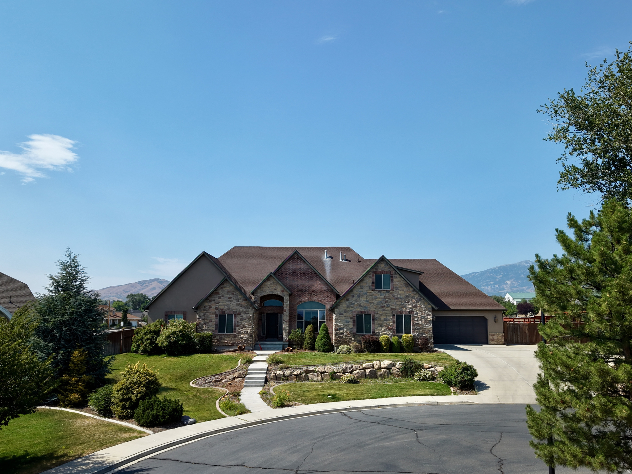 Discover the perfect blend of space, location, and lifestyle in this exceptional 9 bedroom home on a quiet cul-de-sac. Ideally situated on the border of Highland and American Fork, this home offers unbeatable convenience - just minutes from top-rated schools, beautiful parks, shopping, dining, and easy freeway access. With over 7080 SQFT on a large half-acre lot, this beautifully designed home delivers incredible flexibility for today's families. With nine spacious bedrooms, it can easily accommodate a large family, multi-generational living, a private home office, guest suites, or even future income potential through an ADU. Lots of natural light, vaulted ceilings, and timeless hardwood finishes that create a warm, inviting atmosphere perfect for both relaxed everyday living and memorable gatherings. The expansive layout flows seamlessly for comfort and entertaining alike. This is a rare opportunity to own a large home at less than replacement costs in one of Utah County's most desirable communities.