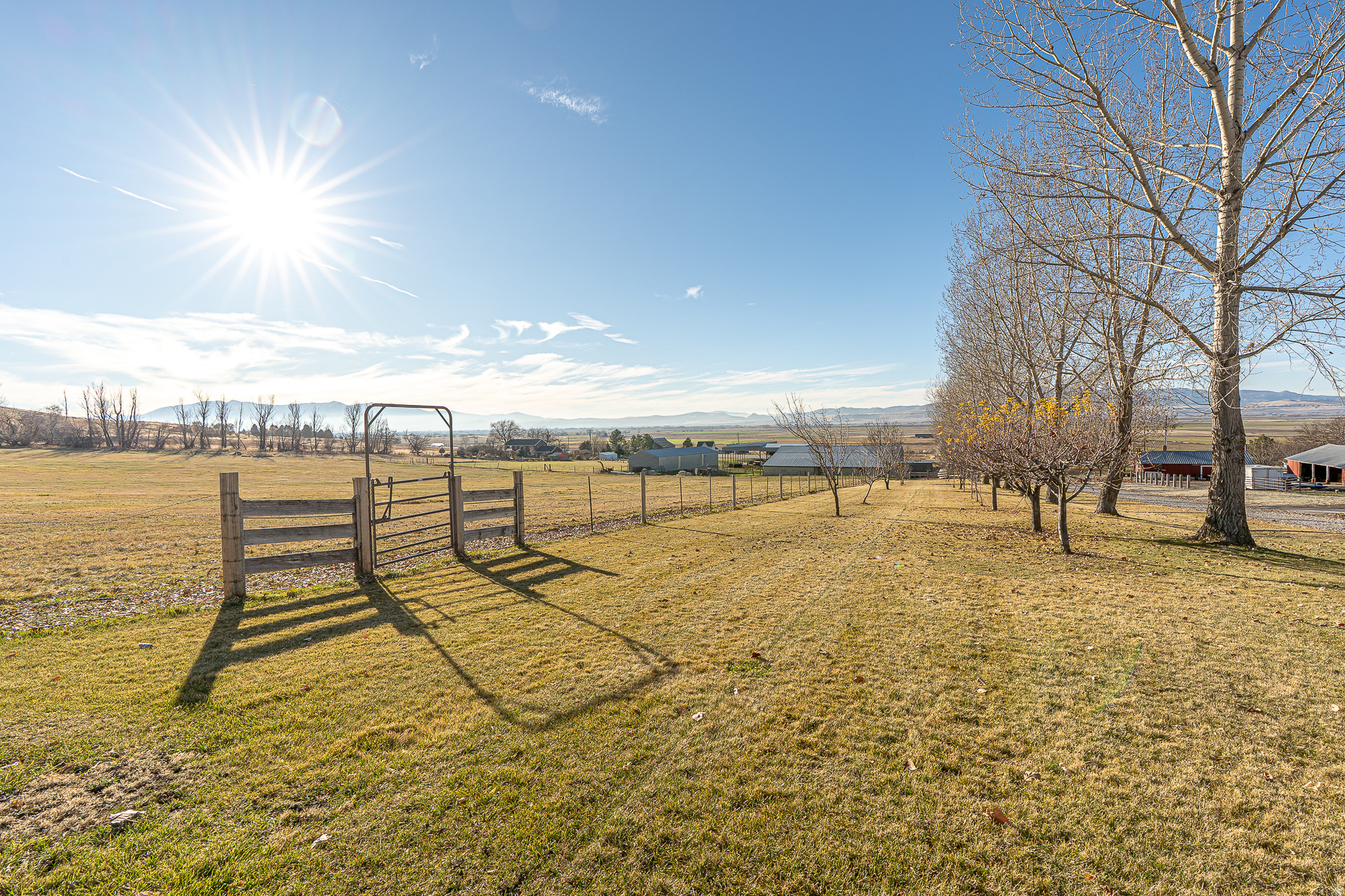 Bring your Dream Home vision to life on this 48 acre property nestled between Richmond and Smithfield! This exceptional parcel offers the perfect blend of privacy, sweeping views, opportunities, and abundant space! With fantastic improvements already in place, this property is ready for its next owner to make their mark. A 20-foot-wide private gravel road/driveway (8500 N) provides direct access to Highway 91 and is lined with beautiful hand-picked apple trees on the southern side. The existing private road runs along the entire northern border of the parcel offering exceptional accessibility and privacy from the highway! The pasture just south of the driveway is ideal for keeping horses, cattle, and other livestock, and is surrounded by stately trees plus equipped with multiple gates for easy access! The lush pasture is serviced by pressurized sprinkler lines utilizing water from the Seller's 15 1/3 irrigation shares with Richmond Irrigation & Power Company. These 15  shares are available for purchase separately with a bill of sale (please ask the listing agent for price). At the east end of the property, higher elevations offer breathtaking 180-degree views of the valley while maintaining privacy and an abundance of space! An approved well permit provides 1.73 ACFT of water, and the buyer is responsible for drilling their own well. Additionally, two more water rights are included, one for 2.8 ACFT and another for 1.2 ACFT. As for utilities, nearby power is located very close to the parcel and sewer would be provided by septic since the parcel is not within city limits. Underground water tank and culinary water lines are on the property and service 3 nearby homes. Parcel is in greenbelt. Please note that the seller is relinquishing this property as part of a 1031 exchange, so seller financing will not be available. Don't miss out on this incredible opportunity to own a piece of paradise! We kindly ask that all showings be scheduled by permission only. Private property signs are posted for your safety and the protection of the property, so please reach out to the listing agent to obtain permission before visiting the property. If you are represented by a buyer's agent, please coordinate all showings through them. For unrepresented buyers, we ask that you coordinate directly with the listing agent. We have provided all the information as a courtesy to you, the buyer. However, it is your responsibility, along with your buyer's agent if you have one, to verify any and all information to your satisfaction. Thank you for your understanding, and we look forward to assisting you. If you have any questions or need further assistance, please don't hesitate to reach out..