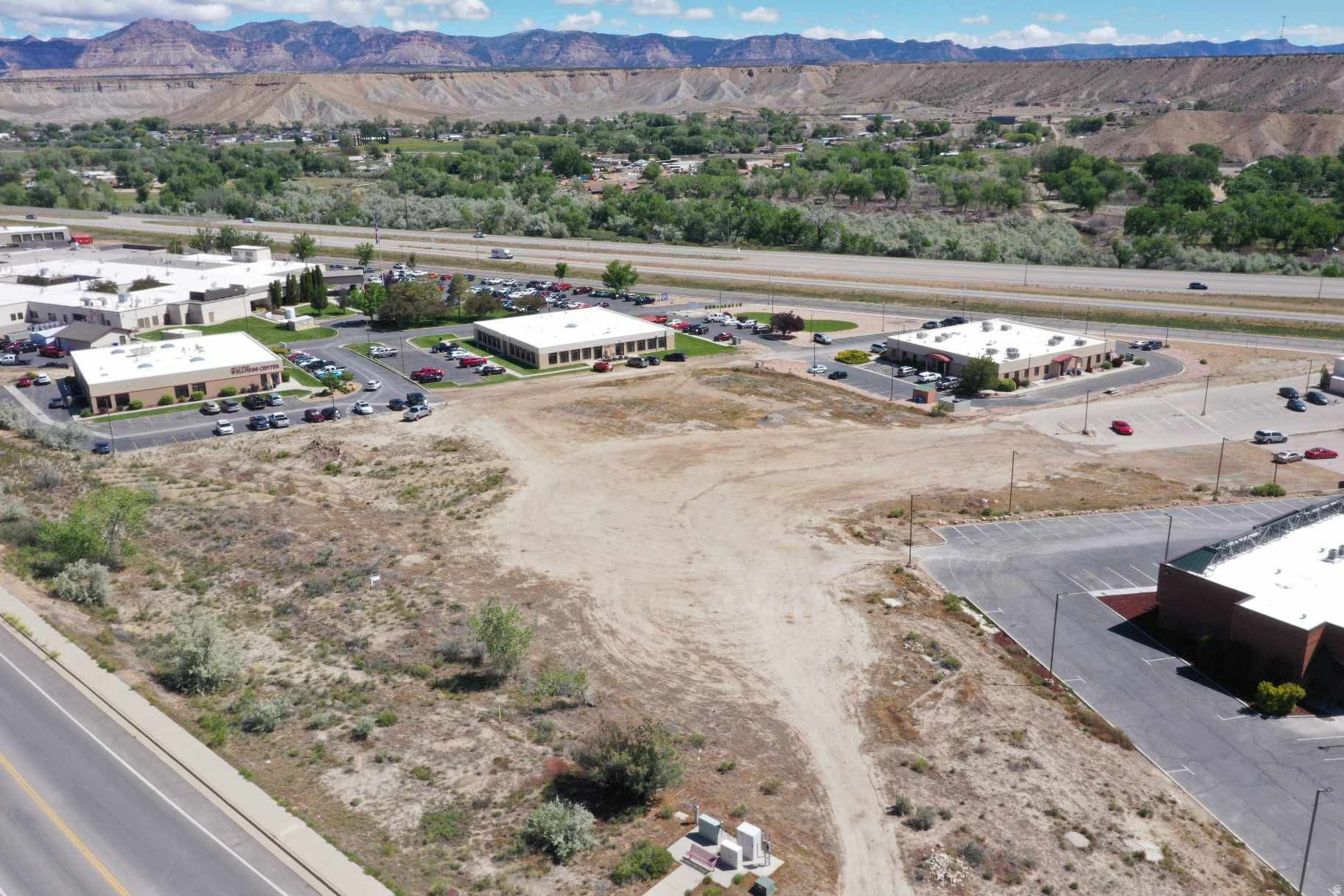 Prime commercial development opportunity in the heart of Price! This 1.90-acre commercial parcel located at 205 Hospital Dr offers excellent visibility and accessibility with approximately 419 feet of frontage and mountain views. Situated in the established Wingers Subdivision Phase 1, this property provides a fantastic location for a variety of commercial uses. Utilities, including gas, power, water, and sewer, are available, helping streamline future development plans. The lot features mature trees, partial fencing, gradual slope terrain, and convenient access via gravel/dirt roadway. Located near medical facilities, businesses, and major traffic corridors, this property presents an exceptional investment opportunity in a growing area of Carbon County. Buyer to verify all information, including zoning, utility connections, and intended use.