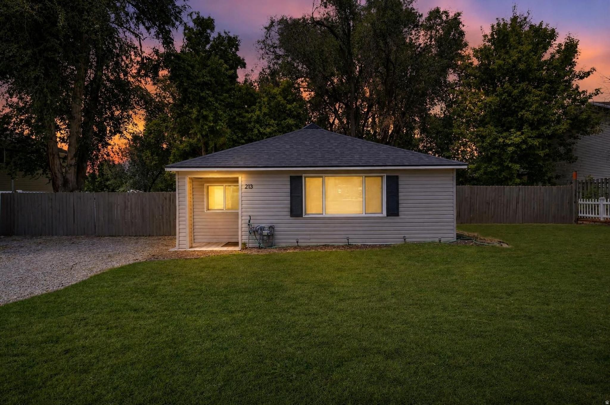Beautifully Updated, Move-In Ready 3 Bed / 2 Bath Layton Bungalow on .37 Acres! This home has been thoughtfully renovated from top to bottom, so all you have to do is move in and enjoy! What truly sets this property apart is the land. Escape to your own retreat with a secluded, shaded backyard with gorgeous mature trees, a shed, and plenty of space to explore building a garage, shop or even an ADU. Major systems have been completely replaced including a new roof, new windows, new furnace, AC, and water heater, updated electrical, and new exterior doors. The inside is warm and bright with a fully remodeled kitchen featuring gorgeous granite countertops and new stainless steel appliances; new bathrooms, and new flooring. The location checks every box: just minutes from grocery stores, EOS Gym, and local restaurants - and only a 5-minute bike ride to the nearest Trax station. Outdoor enthusiasts will love the nearby hiking trails and world-class skiing resorts just ~30 minutes away. Washer, Dryer and Refrigerator included!  (Includes two parcels #10-069-0061 & #10-069-0112 for a total of .37 acre.) Call to see it today!  Sq footage figures are provided as a courtesy estimate only and were obtained from tax data.  Buyer is advised to obtain an independent measurement and verify all.