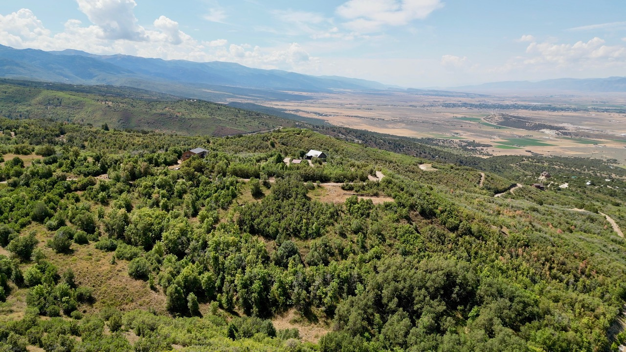 Ready to build? This 1.82-acre lot in Legacy Mountain comes with a cabin pad already cut in, saving you time and money. With good usable space and a gentle slope, it's the perfect launchpad for your dream mountain getaway. Located in a gated community just outside Fairview, this property offers the best of mountain living-quiet privacy, year-round recreation, and sweeping views of the surrounding peaks and valleys. Power and water are available at the road, making the build process smooth and straightforward. Whether you're relaxing under the aspens, watching wildlife pass through your trees, or heading out for a weekend of snowmobiling, hiking, or 4-wheeling, Lot 4 offers a rare blend of convenience, beauty, and adventure. This is more than a lot-it's your place to connect with nature and create something lasting.