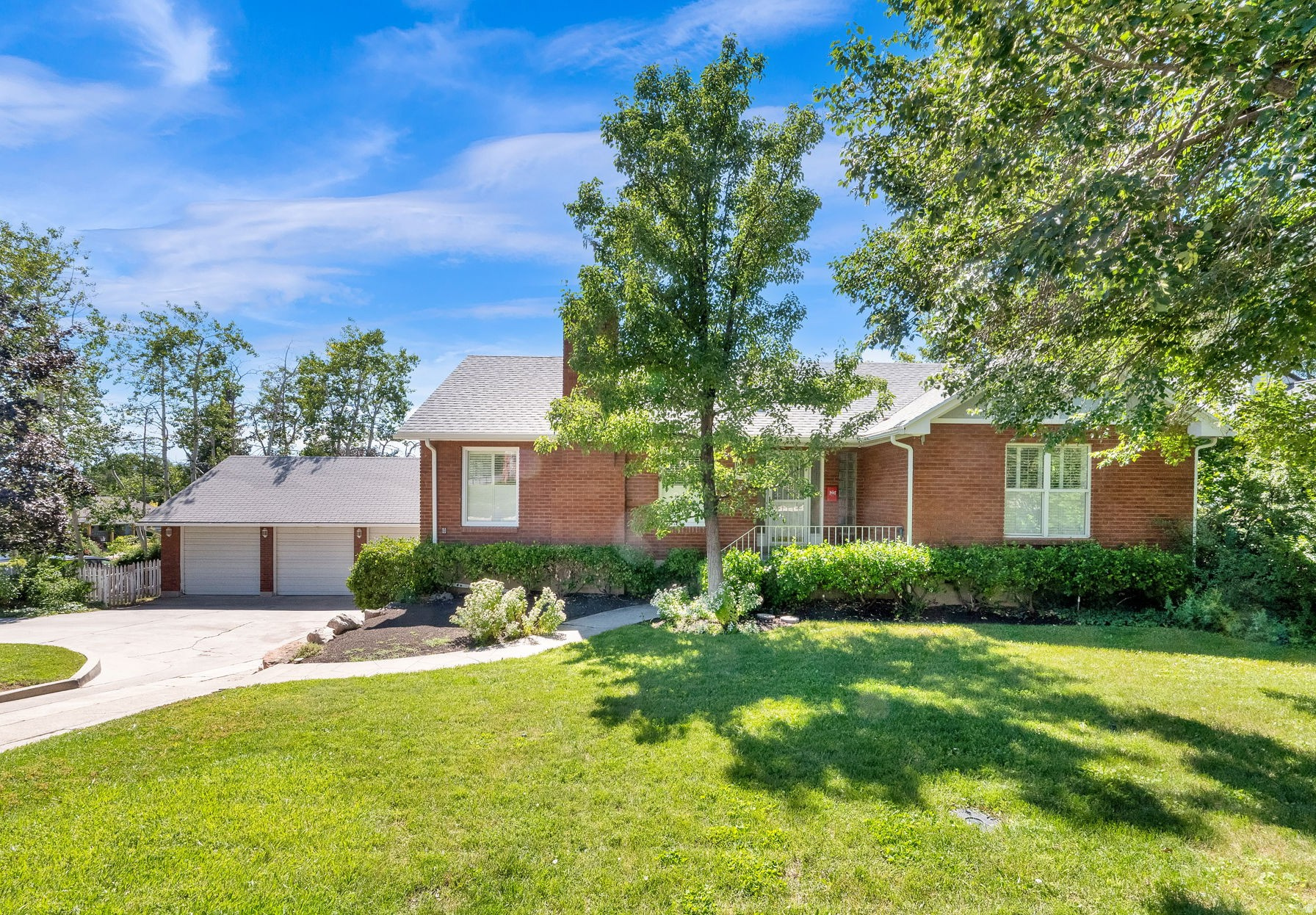 Very rare Millcreek Creek home with multiple possibilities.  Nestled near the base of the Wasatch Mountains in this sought-after neighborhood, this well-maintained original family home offers 5 bedrooms, 2.5 bathrooms, and over 4,000 square feet of versatile living space.  The home offers some Millcreek charm with some modern updates.  Here is your chance to move right in or tackle on a floor at a time.  Natural light throughout with two bedrooms on the upper level and an in-law apartment in the basement.  The well-maintained yard is ideal for year-round fun with two patios and two decks.  The 1/4 turn drive gives ease to the home with a large detached 3 car garage, featuring a side door and even a built-in single-car garage.  (4 garages total)  The basement entrance is near the drive and features its own 2nd kitchen.  The large shop area is the perfect flex space and is included as basement square footage.  Two fireplaces, a wood stove, covered and open decks with patio areas are just the beginning of the backyard fun.  It's the little things like a cellar and laundry chute that set this home apart.  Conveniently close to top-highly rated schools and new shopping and dining.  Outdoor enthusiasts will love the close proximity to hiking and biking trails in nearby Millcreek Canyon.  Don't miss this rare opportunity to own in Millcreek.  Square footage figures are provided as a courtesy estimate only and were obtained from County Assessor & using Cubi Casa.  Buyer is advised to obtain an independent measurement.