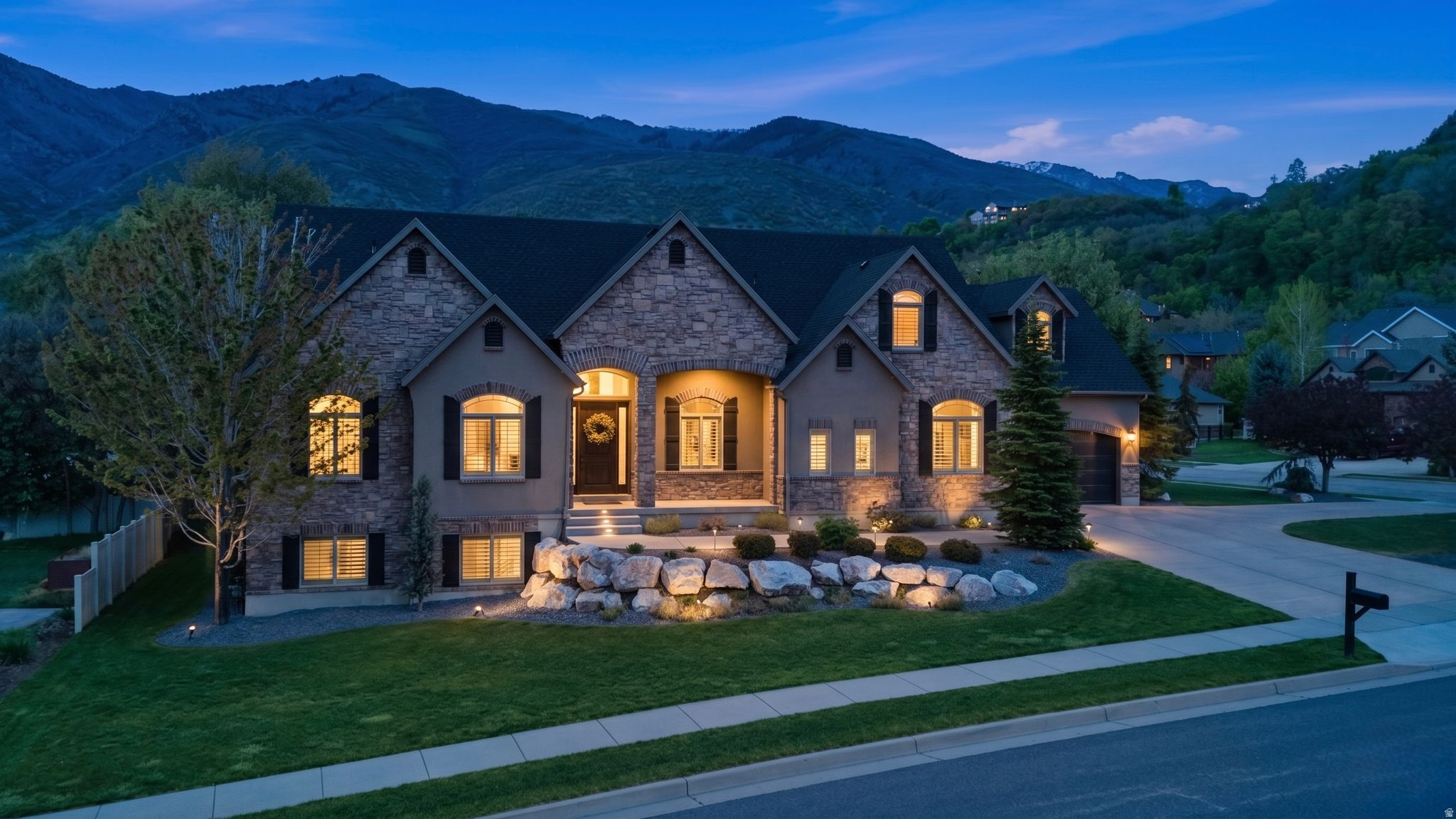 Luxury main-level living in one of South Weber's most sought-after neighborhoods. This meticulously maintained home offers over 5,000 square feet with a stunning primary suite on the main floor, Thermador appliances, soaring ceilings, and breathtaking mountain views. The walkout basement opens to a private backyard retreat and includes space roughed in for a future kitchenette. Recent roof replacement in 2025. Enjoy the perfect combination of elegance, comfort, and convenience just minutes from schools, parks, and commuter routes.