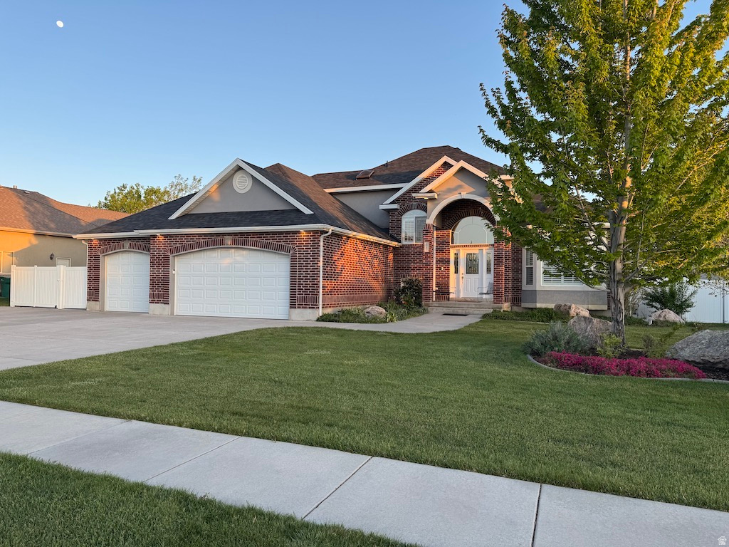 Custom home featuring main level living spacious primary bedroom, walk in closet, attached side room, and ensuite; laundry room; cozy family room with surround sound; and den/office/music room. Hardwood floors. New roof - 2026. Lennox 98% efficient HVAC system - Smart Thermostat. Tankless water heater. Basement expands the home's versatility with private theater room, great room with kitchenette, and separate stairwell entrance. The fenced backyard is a spacious place to gather, relax, or play. The mature trees, gazebo, and patio offer shade throughout the day. Smart controlled sprinkler/drip system. Ample storage and parking. Fenced 15-by-34-foot RV pad, a 3-car garage with storage cabinets, and an extra deep/wide driveway. Walk to Ellison Park. Within minutes of the West Davis Corridor and D&GW Rail Trail. Square footage figures are provided as a courtesy estimate only and were obtained from County records. Buyer is advised to obtain an independent measurement.
