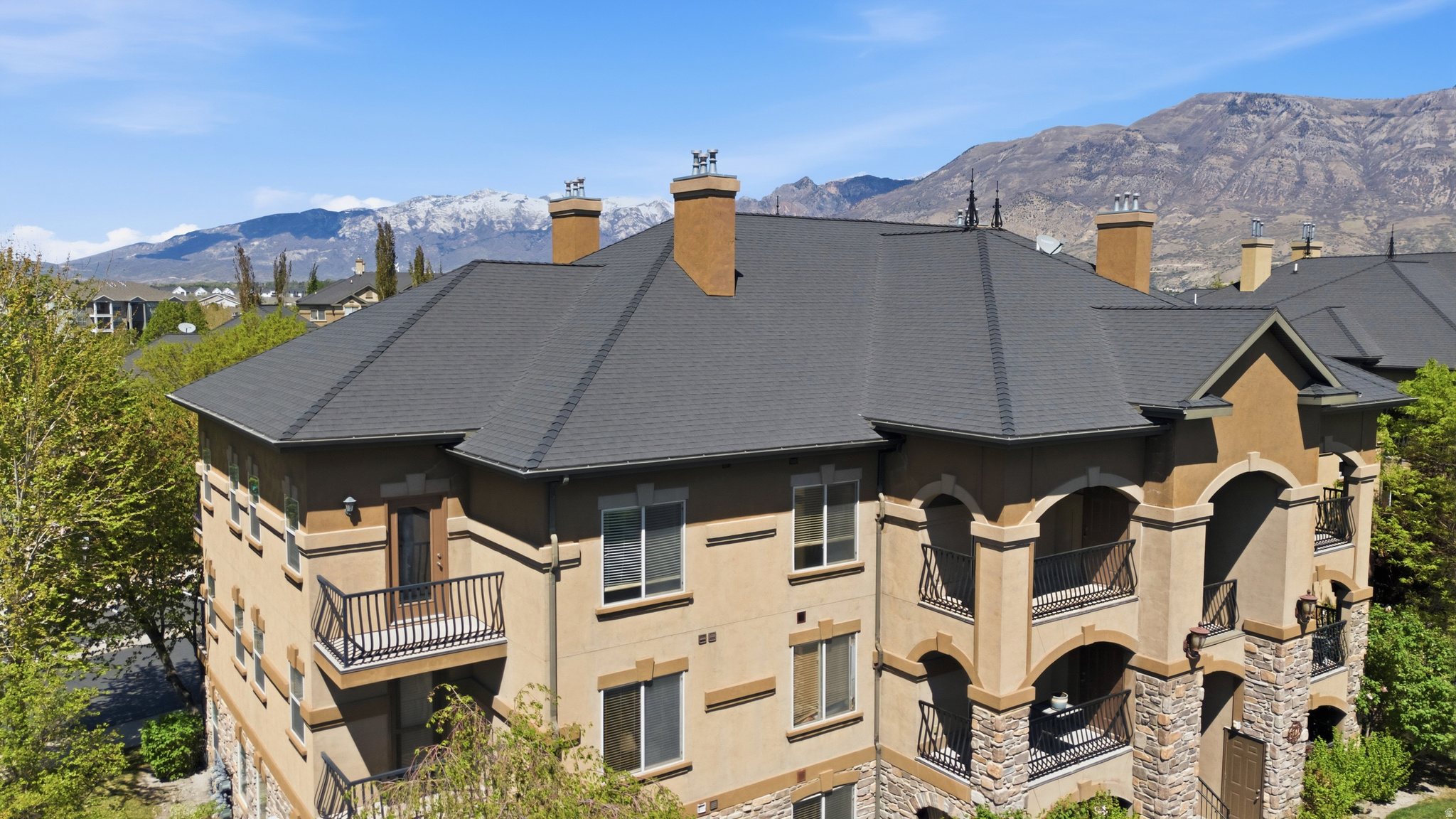 Enjoy peaceful evenings and breathtaking sunsets from your top-floor, south-facing covered deck in the highly sought-after Belle Monet community. Take in sweeping views of the mountains and valley as you unwind in a space that truly feels like home.  This beautifully designed condo features an open floor plan and oversized windows that fill the home with natural light. This home is move in ready, with professional cleaning, new carpet, and LVP throughout home.    Additional highlights include a one-car garage, a reserved parking space, and ample guest parking. You'll also appreciate the convenience of a private, locked storage closet located right on the balcony.  Residents of Belle Monet enjoy access to exceptional HOA amenities, including a clubhouse, park, pool, hot tub, and media package-perfect for both relaxation and entertaining.