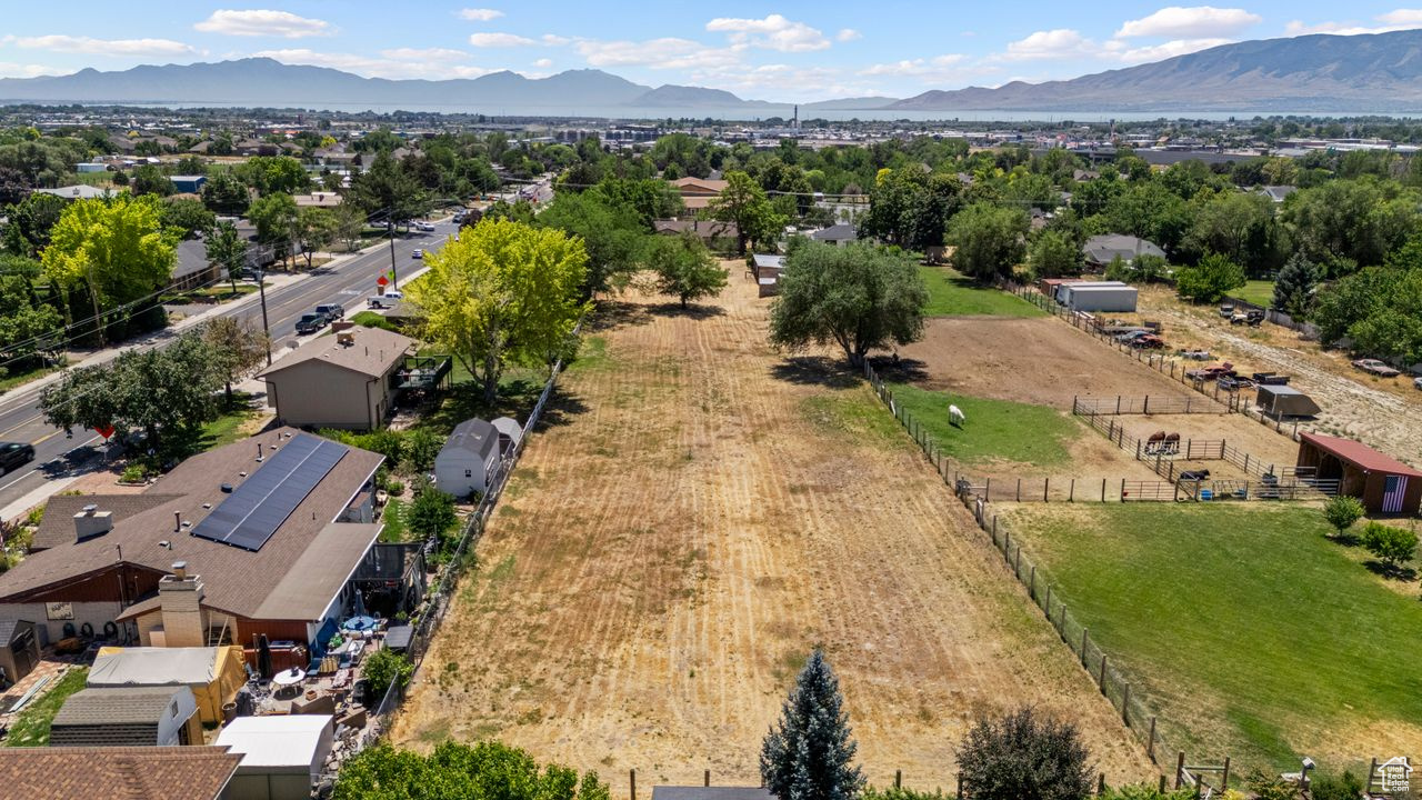 Prime Horse or livestock property. 1.585 acres Sold with parcel # 12-048-0330 .055 for access off of 1200 East to 2 car garage shed, livestock shed, chicken coop, and root cellar.  see MLS #2098065 Has new remodeled 3,244 home 3 bed 3 bath, with single car garage access off of 900n. Fully landscaped yard with mature trees.