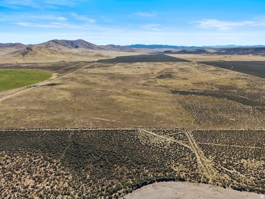Escape to the peace, privacy, and natural beauty of rural living with this exceptional 20.22-acre property. Showcasing breathtaking mountain views, stunning dark night skies, and one acre-foot of water rights, this property offers a rare opportunity to create something truly special. The flat, usable land provides the perfect setting to build your dream ranch, private retreat, or forever home with plenty of room to grow and explore. Enjoy the tranquility of wide-open spaces while remaining close enough to everyday conveniences, services, and amenities. Outdoor enthusiasts will appreciate the abundance of nearby recreational opportunities, making this an ideal location for both adventure and relaxation. Seller financing is available, adding flexibility to this outstanding opportunity. Buyer to verify all information, deemed reliable, however buyer to verify all info including utilities, rental restrictions, and HOA information if applicable.