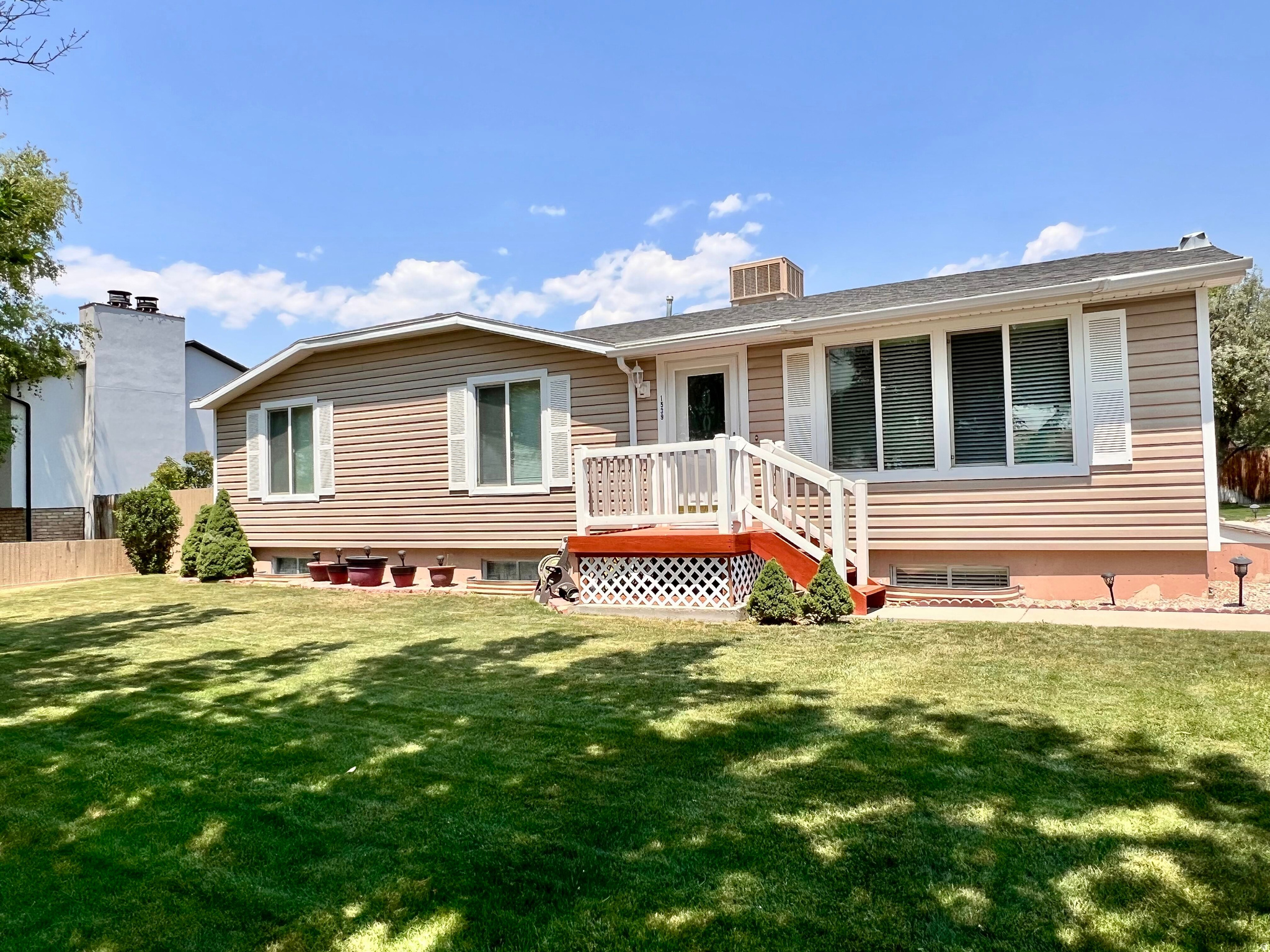 This beautifully maintained home is ready for its next owner and shows true pride of ownership throughout. Featuring a spacious, well-kept yard with automatic sprinklers, you'll enjoy easy maintenance and plenty of room to relax, play, or entertain. The walkout basement adds convenience, functionality, and additional living potential. Located in a desirable neighborhood close to schools, parks, and everyday amenities, this home offers both comfort and convenience. Half of the basement is finished with a family room space and laundry room, the other half can be finished to suit including stubs for future bathroom. Clean, well cared for, and truly move-in ready, this is the kind of property buyers are hoping to find.  Square footage figures are provided as a courtesy estimate only and were obtained from Carbon County Recorder. Buyer is advised to obtain an independent measurement.