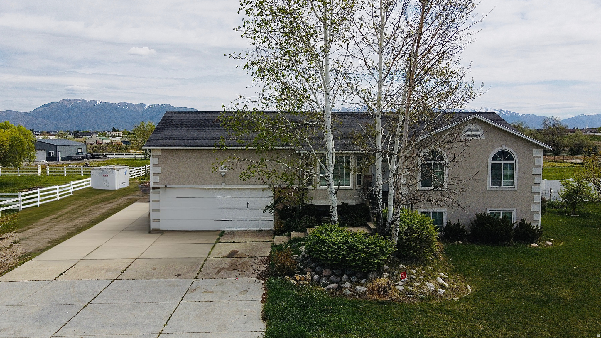 **Price Improvement** Spacious, versatile, and full of opportunity! This impressive 6 bedroom, 4 bathroom horse property in West Point sits on a full acre and is perfectly suited for multi-generational living, rental potential, or those needing extra space. Featuring three kitchens, including an updated main kitchen with modern finishes, this home offers flexibility and functionality rarely found at this price point. Enjoy wide open living with room for animals, toys, and more this horse property provides the ideal setup for country living while still being close to city conveniences. The detached garage adds even more storage and workspace options, perfect for hobbies, equipment, or additional parking. Whether you're looking to accommodate extended family, generate income, or simply spread out and enjoy peaceful surroundings, this unique property checks all the boxes. Don't miss your chance to own a one of a kind home with endless possibilities! **Level 2 square footage is for the bonus room above the detached garage. This room is heated!**