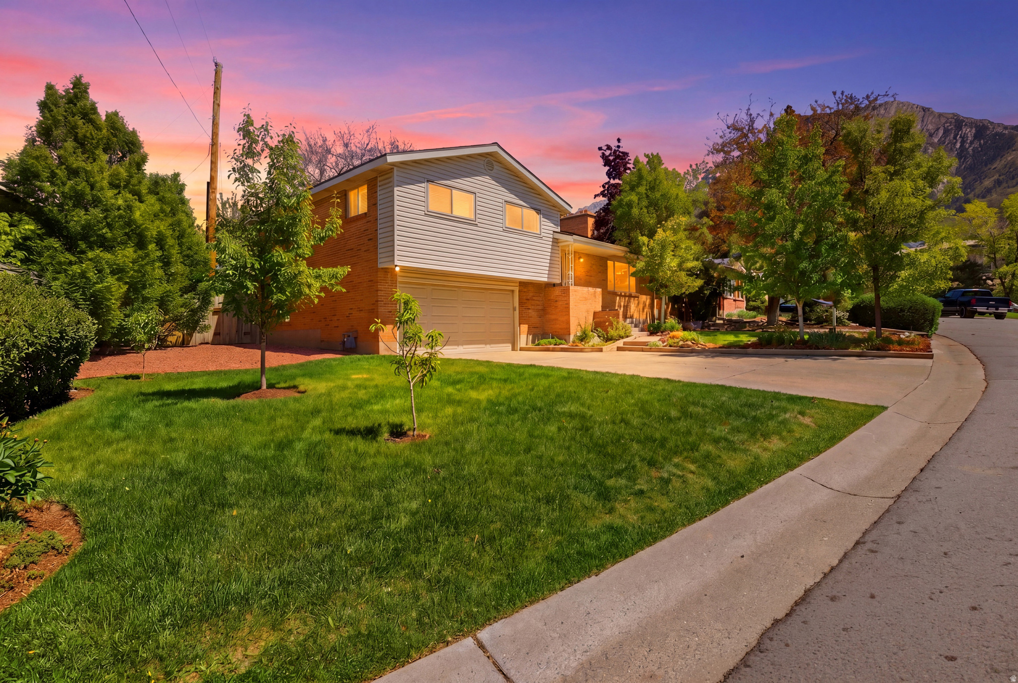 *Price Adjustment* -Seller offering 1/0 rate buydown with preferred lender - 5.58% first-year rate available. Contact agent for details. Beautifully maintained home in the heart of Holladay offering breathtaking Wasatch Mountain views and an unbeatable location just minutes from Big Cottonwood Canyon and Little Cottonwood Canyon, providing quick access to world-class outdoor recreation and skiing. This 3-bedroom home offers multiple living spaces, including a welcoming main-level formal living room with a fireplace and a spacious main-level family room that opens to a covered backyard patio, perfect for entertaining. Possible 4th bedroom conversion with a spacious lower-level family room with fireplace, offering flexible living options for gatherings, relaxation, or multi-generational living. With a nearby bathroom and access to the garage, this level presents excellent potential for a guest suite or future ADU. Situated in one of the most desirable east-side neighborhoods, the property showcases mature landscaping, established trees, and a peaceful residential setting, all while being conveniently close to shopping, dining, and freeway access. Don't miss this rare opportunity to own in a highly sought-after location.  All information herein is deemed reliable but is not guaranteed. Buyer is responsible to verify all listing information, including square feet/acreage, to buyer's own satisfaction.