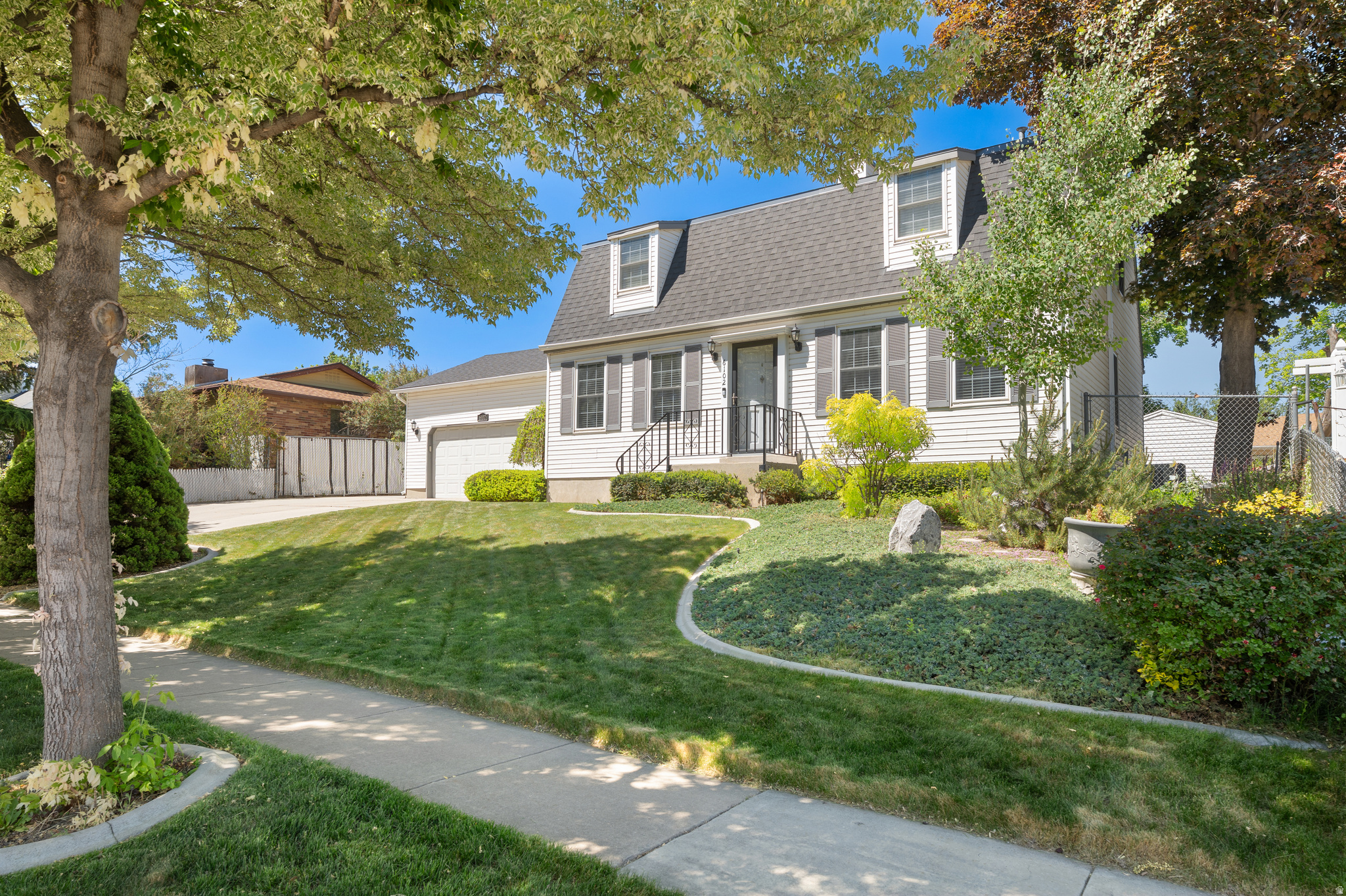 Charming Cape Cod style home with timeless curb appeal and room for everyone!  This spacious 5-bedroom, 3-bathroom residence blends classic character with modern comfort.  Inside, you?ll find a warm and inviting living area centered around a cozy fireplace, a beautifully updated kitchen with granite countertops, and a dedicated theater room with wet bar perfect for movie nights or entertaining guests.  Outside, enjoy a peaceful backyard retreat shaded by mature trees, creating the perfect setting for relaxing afternoons and outdoor gatherings. Garden beds offer plenty of space for flowers, herbs, or vegetables, while the large shed provides excellent storage for tools, hobbies, or recreational equipment.  With generous living space, thoughtful features, and a picturesque yard, this Cape Cod gem offers comfort, charm, and functionality in one beautiful package.
