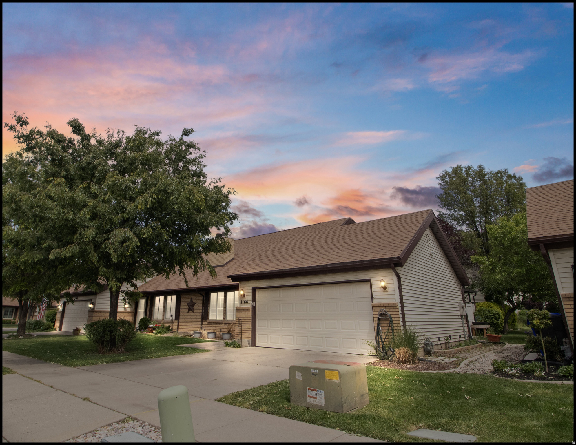 Incredible opportunity! This Chase Lane Village townhome has been cherished by the same family for nearly 27 years. Over the last four years, several updates have been made, including fresh paint, new carpet, LVP flooring, updated lighting, and a new garage door with motor. One of the standout features of these homes is the convenience of main-level living, with the kitchen, dining area, updated bathroom, living room, and primary suite all located on the ground floor.  From the kitchen, step out onto a spacious covered patio-perfect for barbecues, relaxing, and entertaining guests. The soaring vaulted ceilings create an open and airy atmosphere. Upstairs, you'll find a large family room or gathering space, a cozy nook, two additional bedrooms, and a three-quarter bathroom.  Additional highlights include a two-car garage with separate storage space and a generously sized common grassy area, a rare find in townhome communities. The location is exceptional, offering quick north and south access to I-15, minutes from the Megaplex theaters, excellent schools, restaurants, and only an exit away from Station Park to the north and Costco to the south. Centerville Park is within walking distance, featuring eight pickleball courts, a walking/jogging path, playground, pavilion, and baseball and soccer fields.