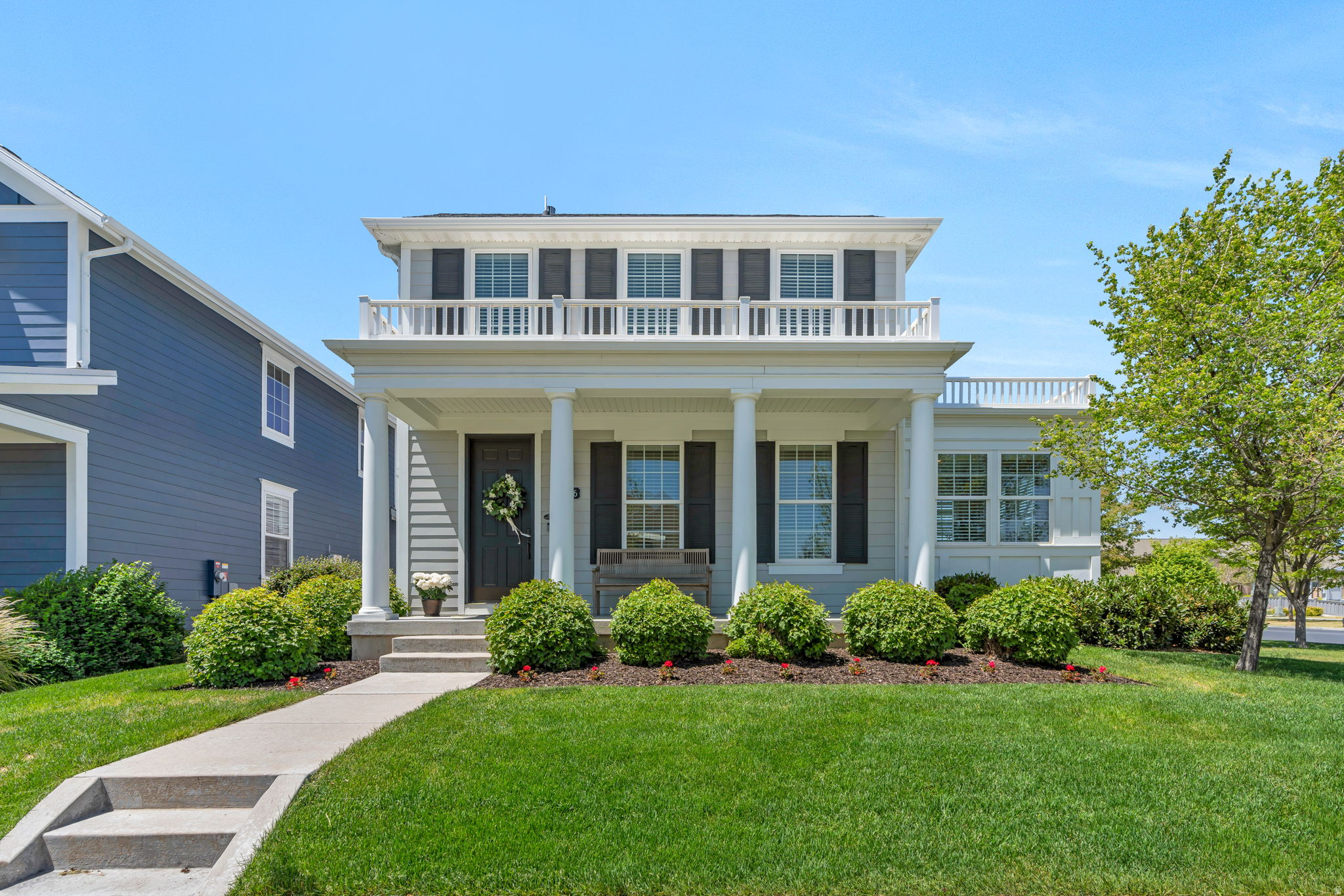 Welcome to this beautiful Daybreak home that feels elevated, comfortable, and welcoming from the moment you arrive.  Perfectly situated on a desirable corner lot with easy driveway access-an uncommon convenience in Daybreak-this home is located in one of the community's most established neighborhoods with mature trees and exceptional walkability.  Inside, the home is filled with thoughtful upgrades including real red oak hardwood floors throughout the main level,  a spacious kitchen with oversized island and recently updated appliances, abundant counter space, and a large pantry. The dining space easily transitions from casual everyday living to more formal entertaining. A stunning sun room addition enhances both the architecture and livability of the home, creating the perfect office, reading room, or peaceful retreat filled with natural light.  Upstairs, the spacious primary suite includes a beautiful euro-style shower, large soaker tub, and private water closet. The fully finished basement includes a large bedroom, expansive family room, bonus flex room ideal for a gym or office, extensive storage space, and plumbing/stubbing already in place for a future kitchen addition. The private backyard is larger than many in Daybreak and features gorgeous landscaping, a covered patio, and a serene outdoor setting ideal for relaxing or entertaining. An inviting front porch is  perfectly positioned to enjoy stunning Wasatch Mountain views.   Additional highlights include a radon mitigation system already installed and setup for a soft-water system. The garage offers exceptional functionality with built-in shelving, bonus storage space, and extra height.   Enjoy being just minutes from the lake, Brookside Park and pool, Bingham Creek Regional Park, the new Harmons grocery store, and both Golden Fields Elementary and Mountain Creek Middle School.  Don't miss this rare opportunity--Schedule your showing today!