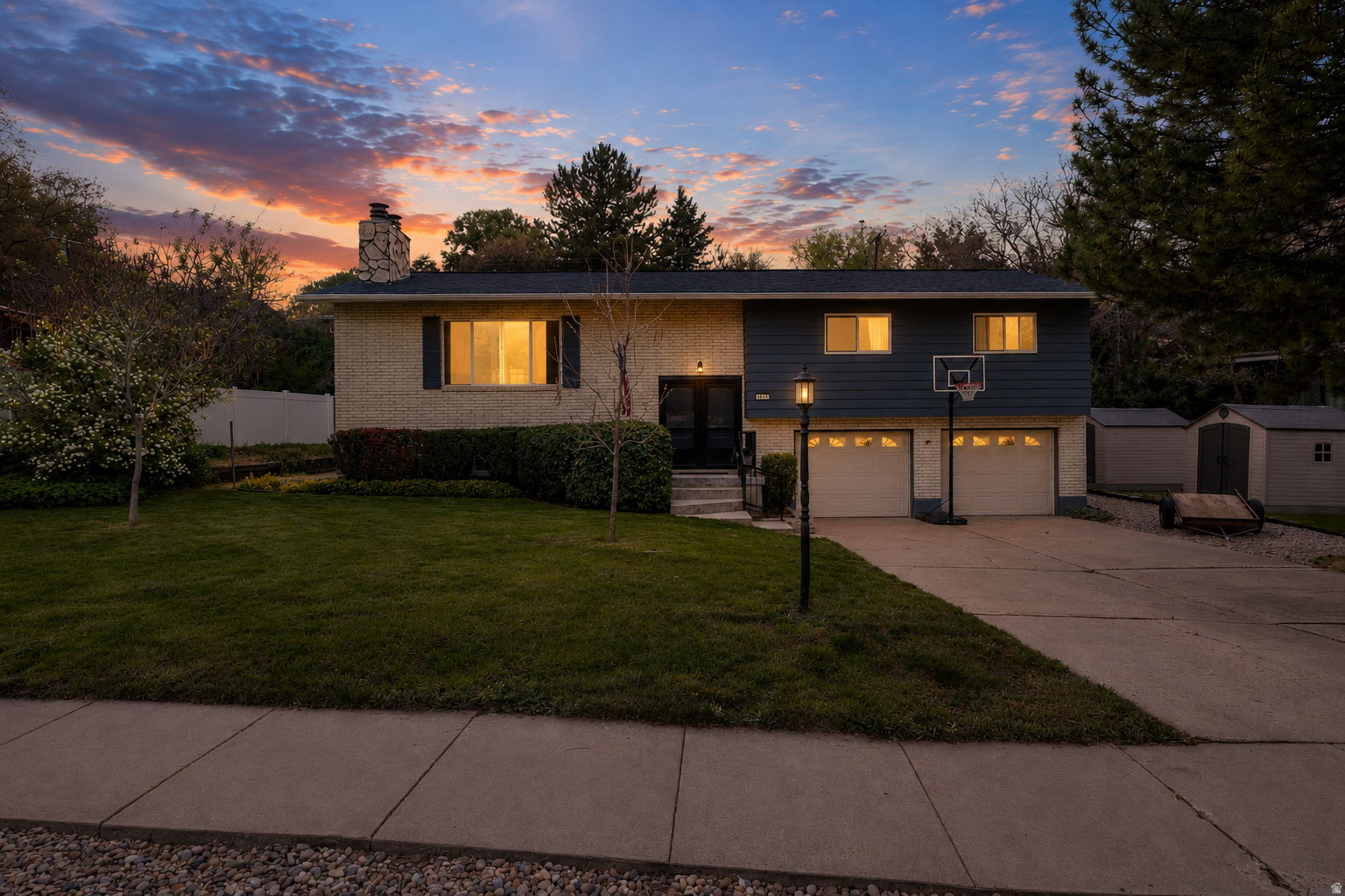 OPEN house 5/16/2026 2PM- 6PM Beautifully maintained South Ogden home located in the desirable Kiwana neighborhood with mature landscaping, incredible outdoor space, and charming character throughout. Situated on a spacious .29-acre lot, this property offers 5 bedrooms, 3 bathrooms, and a functional layout with multiple living and gathering spaces.  Inside, you'll find large windows providing natural light, updated finishes, unique Tiffany-style lighting accents, and a warm inviting feel throughout the home. The kitchen and dining areas flow nicely into the living spaces, creating an ideal setup for entertaining or everyday living.  The backyard is one of the standout features of the property with mature trees, a fully landscaped yard, outdoor gathering areas, storage sheds, and plenty of usable space to enjoy. The property offers a peaceful setting while still being conveniently located near shopping, dining, schools, parks, recreation, and commuter access.  Additional features include basement space with flexible use options, ample storage, established landscaping, and excellent curb appeal in an established South Ogden location.  Square footage figures are provided as a courtesy estimate only and were obtained from county records. Buyer is advised to obtain an independent measurement.