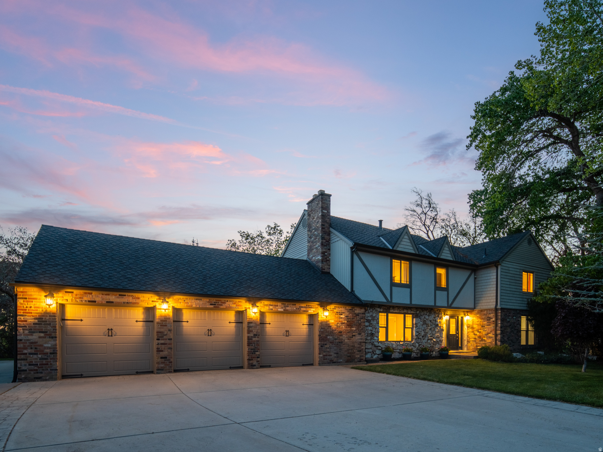 *PRICE IMPROVEMENT! * Tucked against the Wasatch foothills on nearly an acre, this Tudor-style estate offers a rare sense of privacy and calm just minutes from the city. Mature oaks and pines surround the property, while the ridgeline rises dramatically just beyond the home, creating a setting that feels both secluded and connected to nature.  Two expansive 50-foot decks and a lower patio extend the living space outdoors, where a private waterfall feature and mountain backdrop create a peaceful retreat for entertaining or quiet evenings at home.  Inside, the home has undergone a comprehensive professional renovation, blending timeless Tudor character with updated design and infrastructure. Improvements include designer-selected finishes, new hardwood flooring, a fully remodeled chef's kitchen, and extensive mechanical and electrical updates throughout.  The primary suite opens directly to the upper deck, while the lower level includes a fully independent guest or in-law suite complete with its own entrance and kitchen, offering flexibility for extended family, guests, or multi-generational living.  Featuring six bedrooms, 4,526 square feet, and two parcels, this is a property that combines space, privacy, and mountain living in one of the valley's most distinctive settings.All property information, boundaries and documents to be verified by buyer.