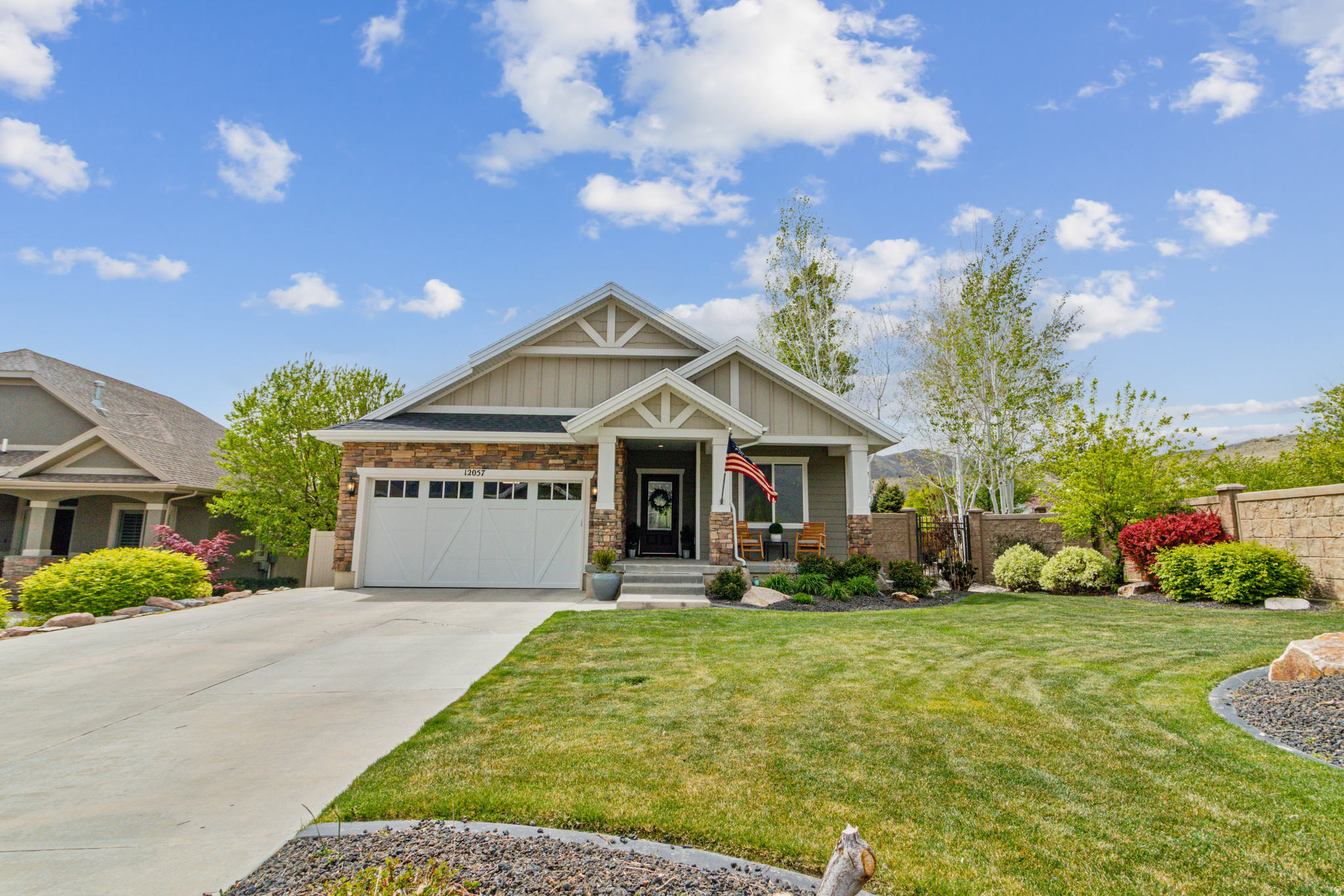 Absolutely beautiful rambler in the highly sought-after Skye Estates community, offering exceptional main-level living with a fully finished basement and second full kitchen. A separate basement entrance provides ideal flexibility for a mother-in-law apartment or guest suite. This home is loaded with upgrades, including hardwood flooring, custom cabinetry, and a premium stainless steel appliance package featuring double ovens and a gas range. The kitchen is finished with granite countertops, complemented by custom tile work and designer paint throughout. The upstairs great room is enhanced with a Klipsch surround sound system, and the home also includes an alarm system with cameras for added peace of mind. Step outside to a showpiece backyard, complete with a tranquil water feature and an awning-covered patio, perfect for relaxing or entertaining. The 8.34 kW solar system is a standout feature, with an average electric bill of just $11/month. Enjoy resort-style living with HOA amenities that include a pool, clubhouse, theater room, great room, and kitchen, ideal for hosting larger gatherings.