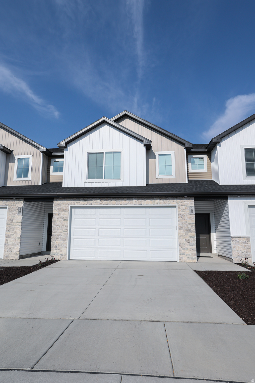 This unit is under construction and estimated completion is early November 2026. Full length driveway allows for 2 large cars to be parked in the driveway and have 2 in the garage. The home has 3 bedrooms upstairs with a large Laundry room. At the top of the stairs is a desk area for the work from home station. Stainless steel appliances and Quartz countertops with cabinets to the ceiling in the kitchen for added storage. Large windows to take in the views of the north end of Cache Valley! Internet is included in the HOA fee. *Pictures are of previous completed unit, please be aware this unit will look identical but may be various stages of construction* This unit is an END unit.