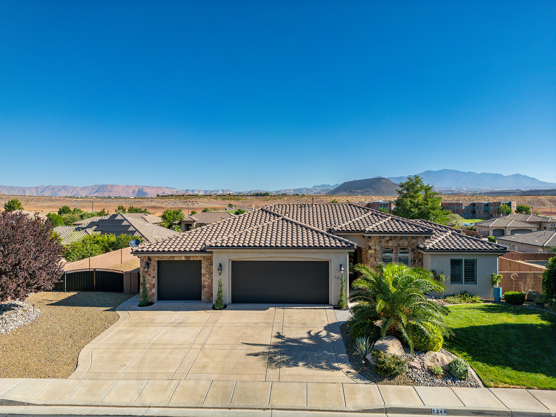 Enjoy single-level living with room for all your vehicles, toys, and outdoor entertaining! This well-maintained 4-bedroom, 2-bath home offers 2,091 sq. ft. on a spacious 0.23-acre lot with RV parking, a 4-car garage, and mountain views. Built in 2012, the home features a thoughtfully designed floor plan with a large kitchen complete with stainless steel appliances and wood cabinets. Plantation shutters, ceiling fans, and a blend of carpet, tile, and LVP flooring add both style and comfort. The spacious primary suite offers a relaxing retreat with mountain views, a walk-in closet, double vanity, jetted tub, and separate walk-in shower. You'll also appreciate the large laundry room with built-in cabinets for extra storage. Step outside to a fully fenced, fully landscaped backyard designed for low-maintenance living, featuring xeriscape landscaping, a firepit, and two covered patios-perfect for relaxing or entertaining while taking in the mountain views.