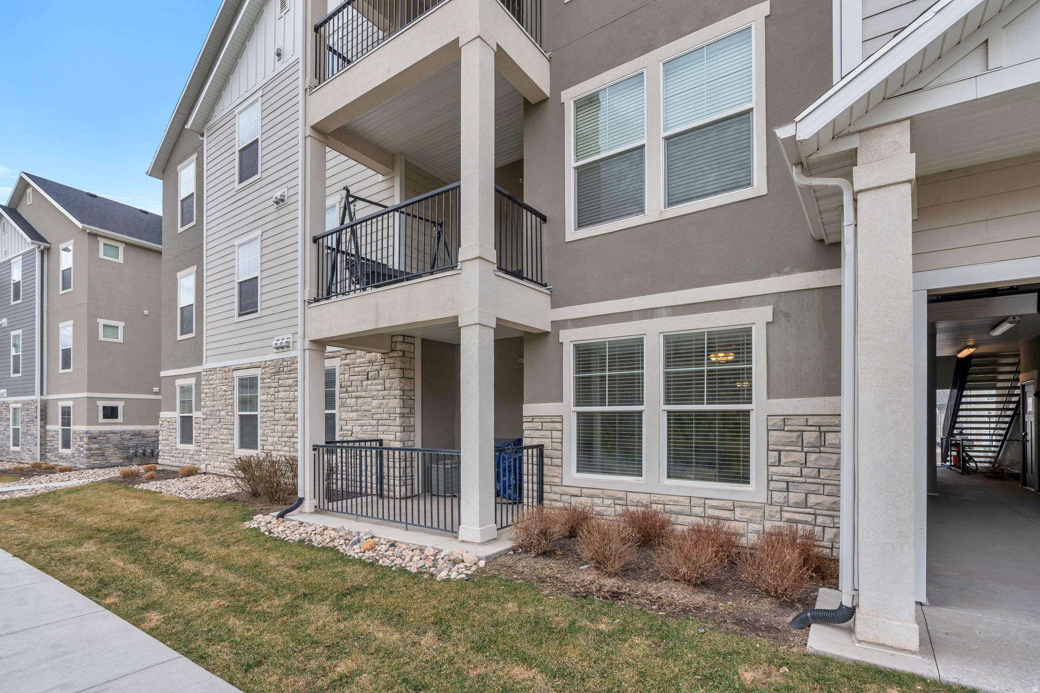 WE ARE LOOKING FOR A CASH BUYER/INVESTOR.  NO RENTERS IN PLACE, OWNER OCCUPIED.  TALK TO LIST AGENT FOR DETAILS. Super clean, like-new main floor condo with open space and walking trails right outside your patio!  Best views!  This bright and inviting home features a pretty kitchen with quartz countertops, white cabinets, stainless steel appliances (all included), and a large pantry. Spacious primary suite with walk-in closet, large laundry room, and direct access from the 1-car garage into the home. Enjoy relaxing on the cute fenced patio with mountain views. Tankless water heater for added efficiency. Community amenities include a pool, clubhouse, playgrounds, and walking trails. HOA fee covers water, sewer, and garbage so there's no separate city utility bill.
