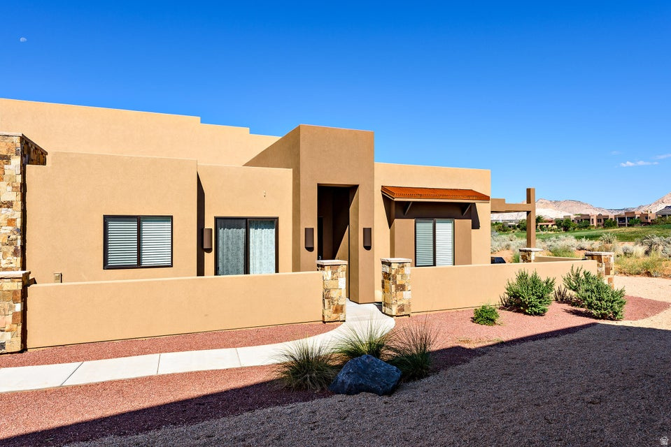 Perched along the 18th hole of the renowned The Ledges Golf Club, this exceptional single-level investment property offers breathtaking golf course and Snow Canyon State Park views. Featuring 3 bedrooms and 2 baths, this fully furnished turnkey retreat is approved for nightly rentals, making it the perfect vacation home or income-producing opportunity. Ideally located just steps from the swimming pool and pickleball courts, this property combines luxury, convenience, and unbeatable scenery in one incredible package.