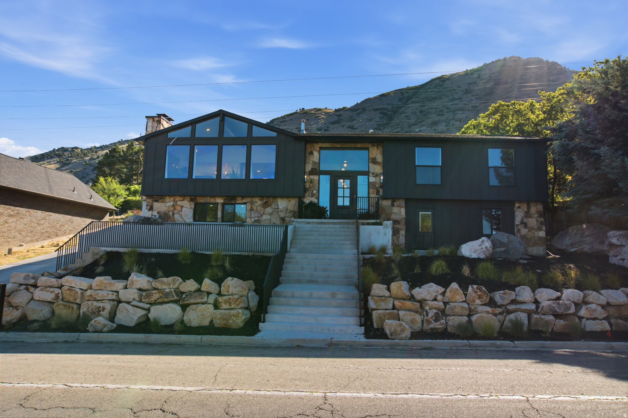 Some homes have views. This one makes the view part of the floor plan.  Welcome to 4078 N Foothill Dr, a beautifully updated North Provo home where modern finishes, flexible living space, and sweeping valley views all come together in one seriously livable package. Set near the Provo foothills, this home gives you that elevated, tucked-away feeling while keeping you close to the best parts of Provo, Orem, BYU, Provo Canyon, and everyday conveniences.  Inside, the home feels fresh, open, and intentional. The main living area is bright and welcoming, with large windows that pull in the valley views and natural light. The kitchen has the kind of updates buyers actually care about: custom cabinetry, quartz countertops, an open layout, and a large butler's pantry that makes entertaining, hosting, and day-to-day living easier and better looking.  The main level includes a spacious living area, two bedrooms, and a standout primary suite with an en suite bathroom. The primary closet also includes washer/dryer hookups, which is one of those small luxuries that quickly becomes hard to live without.  Downstairs, the home keeps delivering. You'll find additional living and entertaining space, a hobby room or office, a large laundry room with generous cabinet storage, and a flexible 2-bedroom, 1-bath apartment-style setup with its own kitchen. Whether used for guests, long-term visitors, a creative workspace, or extra lifestyle flexibility, the lower level adds real function without sacrificing comfort.  Outside, the lot is a major advantage. At roughly one-third of an acre, it is not just a yard you look at - it is a yard you can actually use. Think summer dinners, sunset conversations, weekend gatherings, and space to enjoy the views instead of just talking about them. Add in a spacious two-car garage, and the home checks the practical boxes too.  The location is just as compelling. This part of North Provo puts you close to the foothills, Rock Canyon, the Bonneville Shoreline Trail, the Provo River Parkway, Provo Canyon, Riverwoods dining and shopping, and some of the most recognizable outdoor access in Utah Valley. Hike before work, bike after dinner, meet friends for a night out, or stay home and watch the valley lights come on.