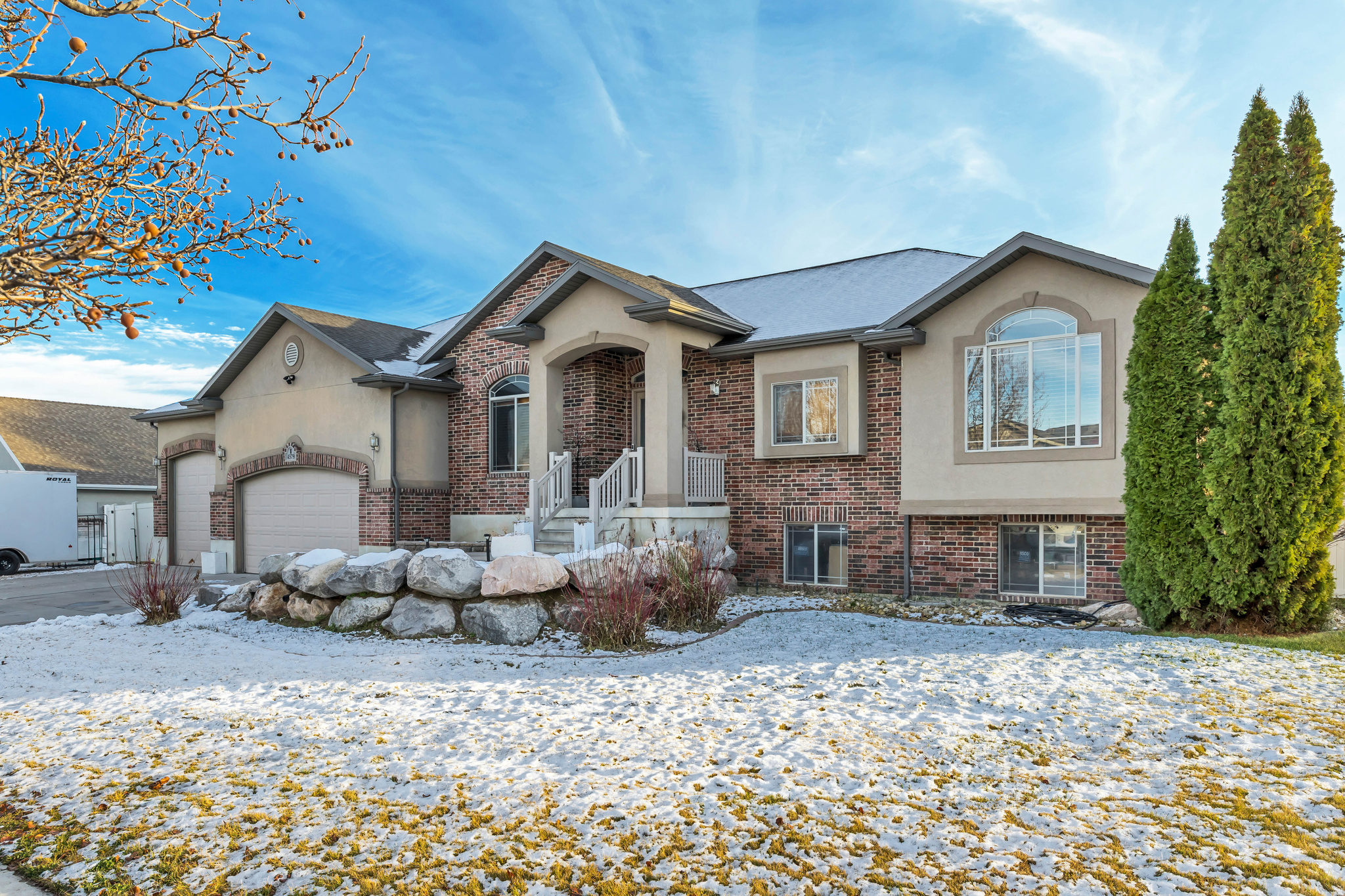 Set on an expansive 0.57-acre lot, this thoughtfully designed rambler blends generous space, modern comfort, and room to grow. Built in 2007, the home offers over 3,600 sq. ft. of living space, with 1,808 sq. ft. on the main level and 1,796 sq. ft. in the basement, creating a layout that feels open, functional, and welcoming from the moment you step inside. The main level features three well-appointed bedrooms, including a spacious primary suite, along with 2.5 bathrooms that provide both convenience and privacy. The heart of the home is its open, modern kitchen, perfectly positioned between a large living room and an inviting dining area. Whether you're hosting or keeping things simple at home, the flow of these spaces makes everyday living feel effortless. The partially finished basement offers valuable flexibility with two additional bedrooms and a full bathroom already completed. The remaining unfinished space is ideal for future customization, home theater, gym, recreation room, storage, or anything your lifestyle demands. Car enthusiasts and hobbyists will appreciate the massive garage, offering space for up to five vehicles and plenty of additional room for tools, equipment, or recreational gear. Thoughtful upgrades add peace of mind and efficiency throughout the home, including a new water heater installed in April 2025, a full solar panel system, Ring doorbell, exterior security system, and wooden blinds in every room. These enhancements elevate both comfort and long-term value. Outdoors, the oversized lot provides remarkable potential, gardening, play areas, outdoor living, or future additions, while still offering privacy and a sense of space rarely found in newer developments. Located in a well-established neighborhood with convenient access to schools, parks, and everyday amenities, the home offers a lifestyle that's both connected and comfortably residential. Homes with this combination of square footage, acreage, and upgrades don't come around often. Schedule a private tour and experience the possibilities firsthand.