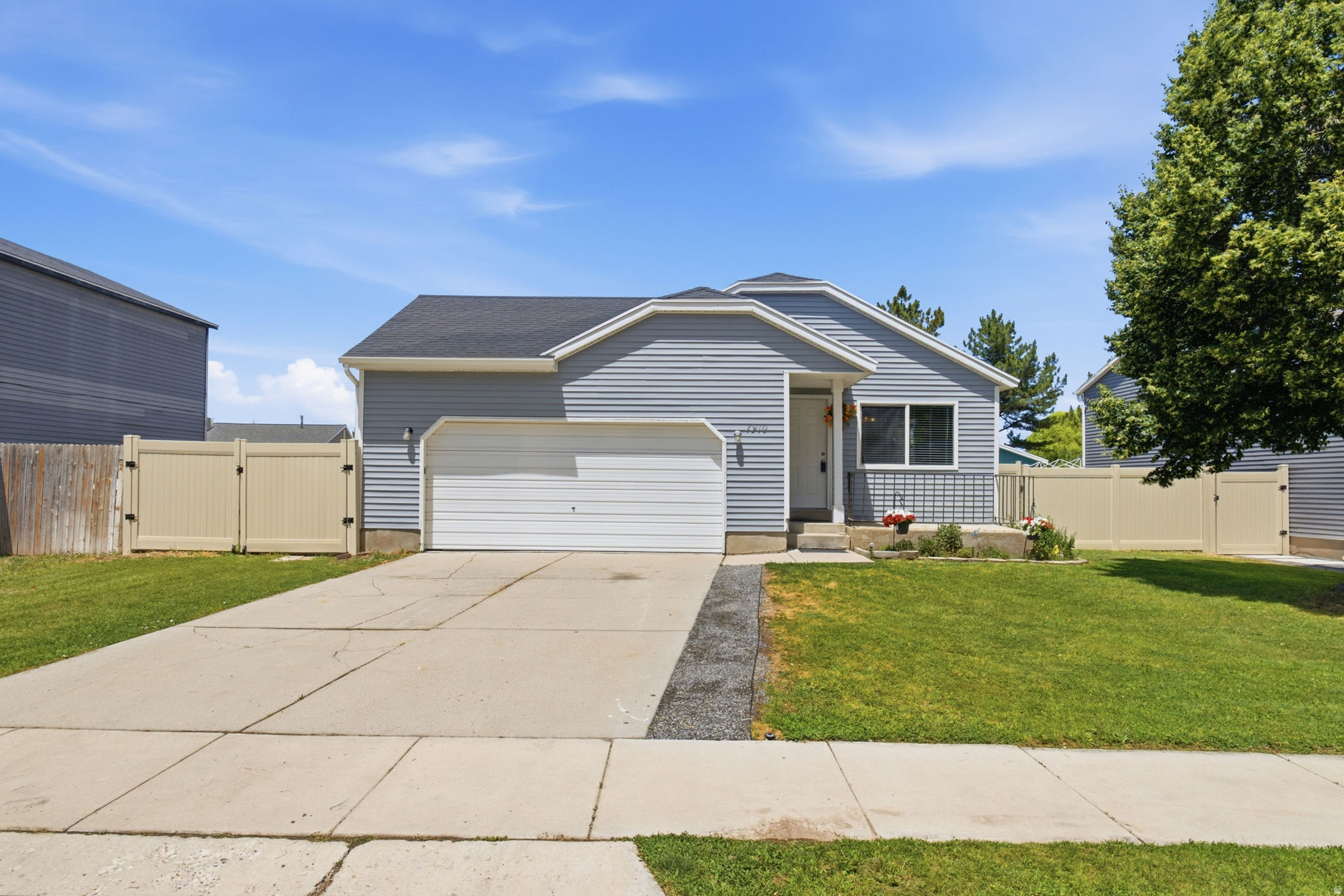 *** OPEN HOUSE on Saturday July 11th from 11am - 1pm *** Welcome to this beautifully maintained 4-bedroom, 2-bath home offering 1,538 sq ft of comfortable living space and no HOA. With two spacious family rooms, a cozy fireplace, and a 100% finished basement, there's plenty of room to relax, entertain, or accommodate a growing household. You'll love the vaulted ceilings, fresh interior paint, new laminate flooring throughout the home, and tile flooring in the kitchen and bathrooms. The upstairs bathroom has been completely remodeled with a brand-new tub and updated flooring, adding a fresh, modern touch. Major updates include a new roof and central A/C installed in 2017, providing added value and peace of mind.  The fully fenced backyard offers space to enjoy the outdoors and includes a storage shed equipped with a cooler system for added versatility. Additional storage can be found in the garage, on the patio, and in the shed, making it easy to keep everything organized.  Whether you're searching for your first home or a great investment opportunity, this property is an excellent choice. Conveniently located near shopping, dining, schools, parks, and everyday amenities, and just about one mile from SR-201, offering quick access to downtown Salt Lake City, the Salt Lake International Airport, and other destinations throughout the Salt Lake Valley.